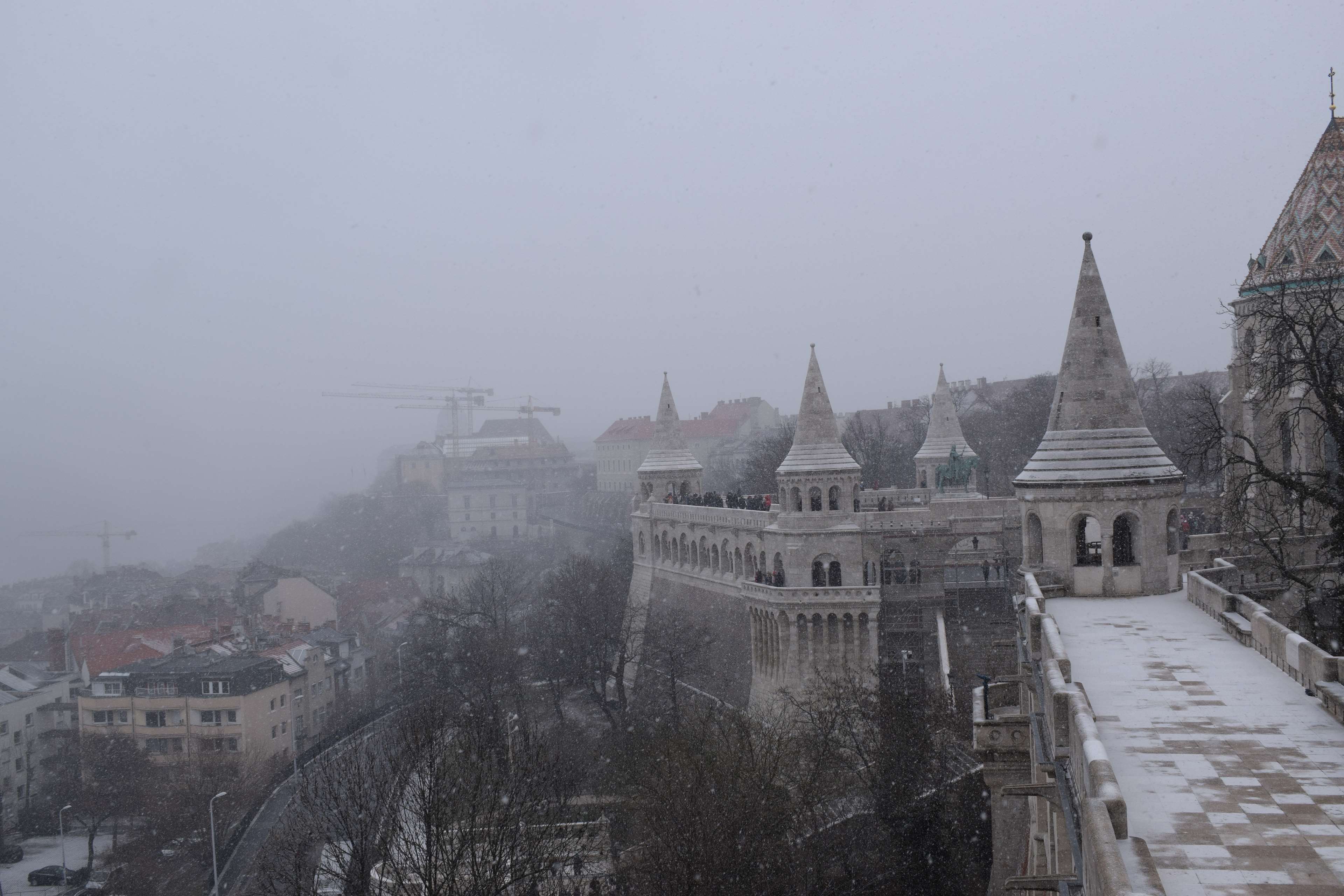 Fisherman's Bastion in Budapest during winter snowfall HD Wallpaper