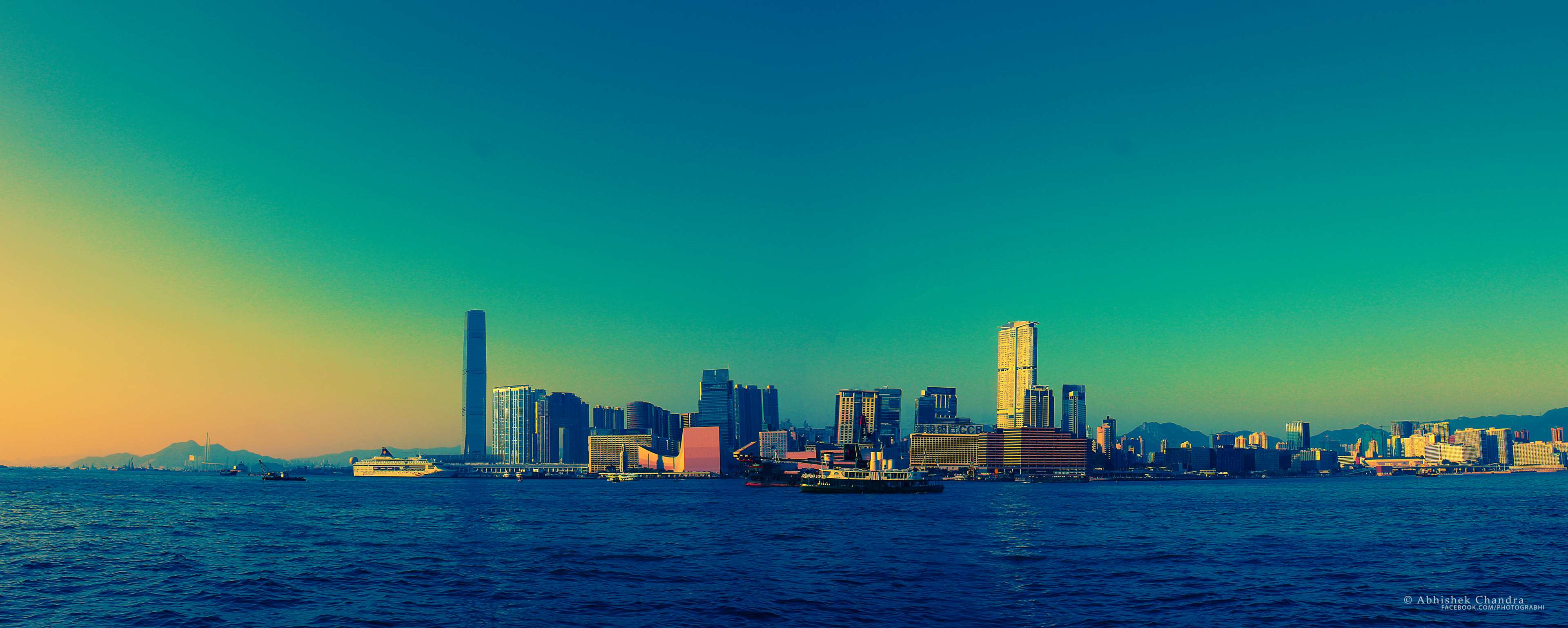 Hong Kong skyline across the ocean at sunset 4K HD Wallpaper