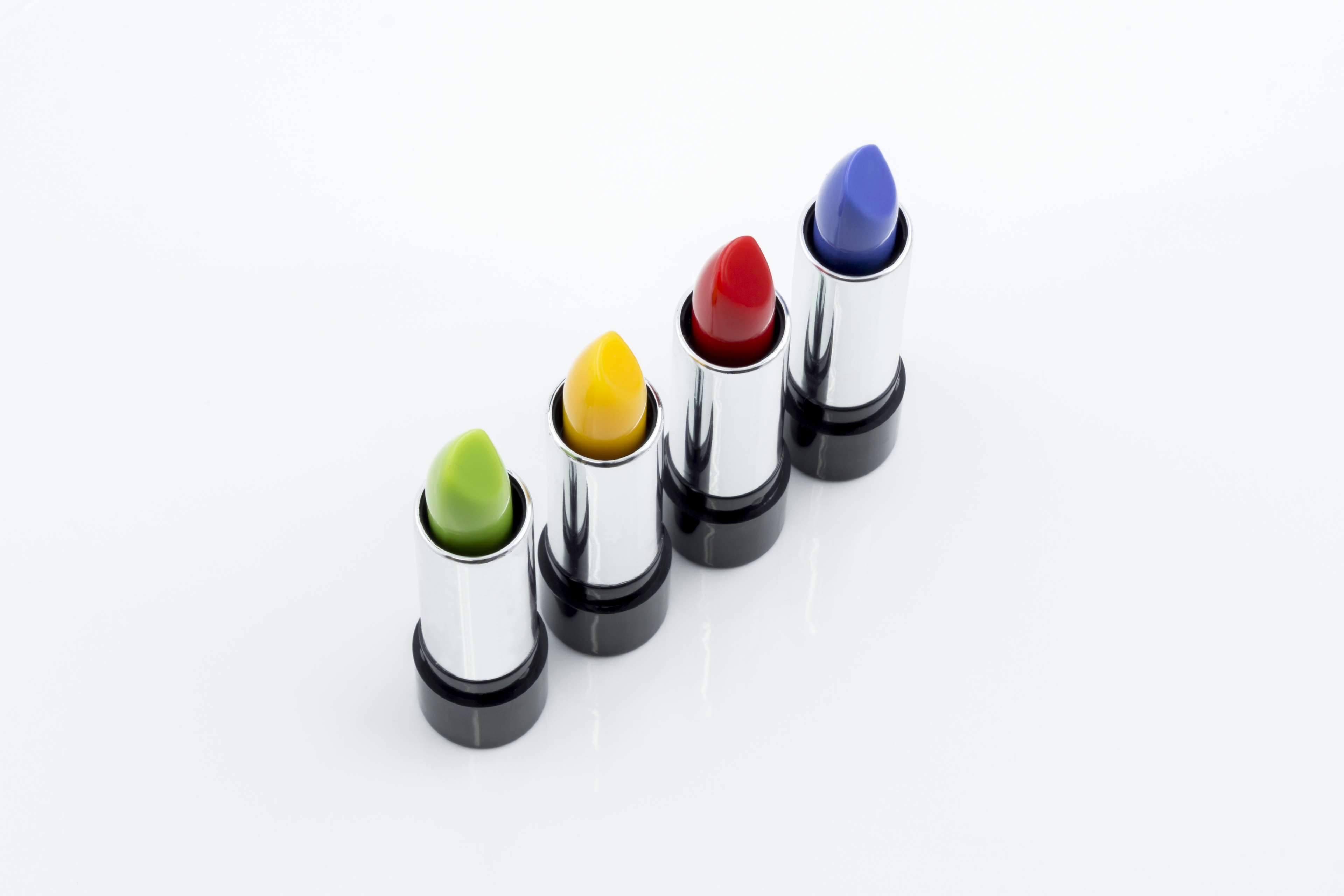 Four lipsticks in different colors HD Wallpaper