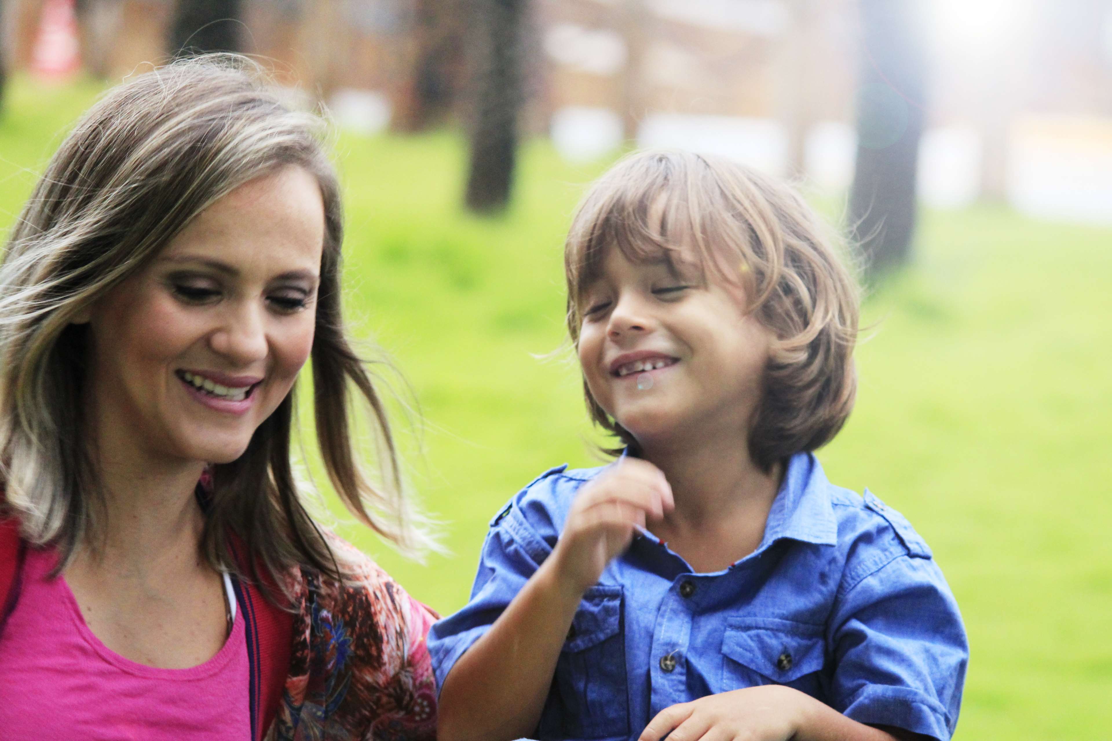 Mother and son smiling in a park 4K HD Wallpaper