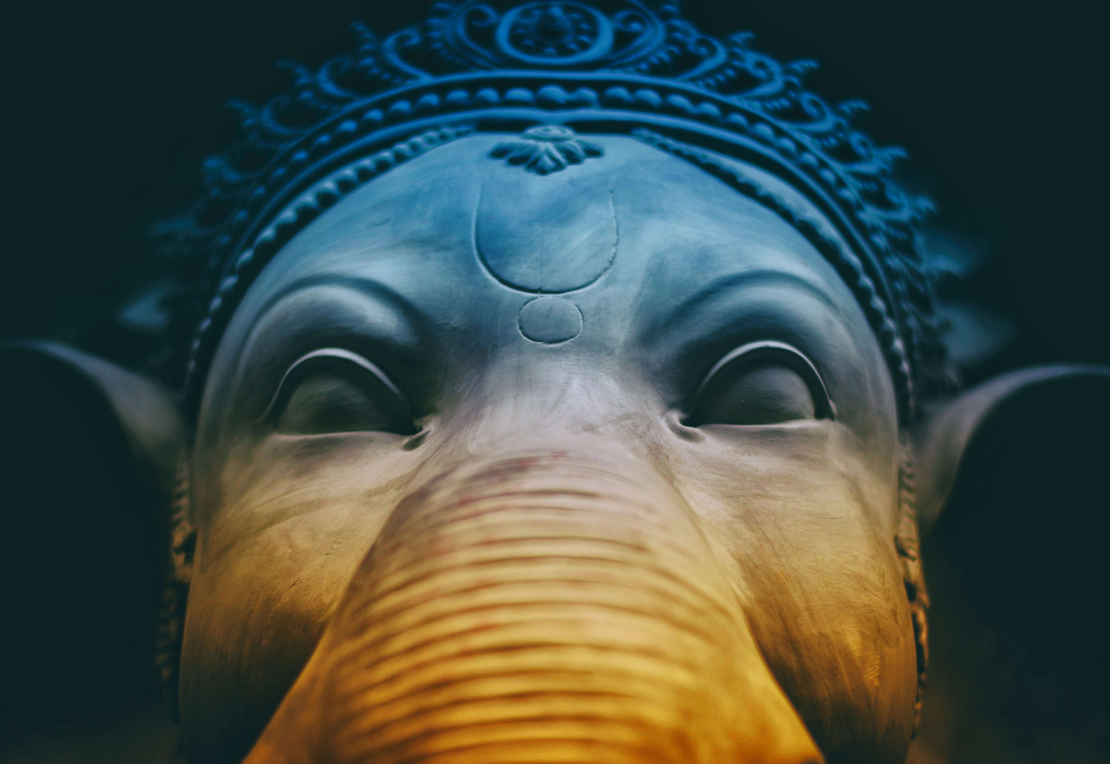 Close up sculpture of Ganesha's face 4K HD Wallpaper