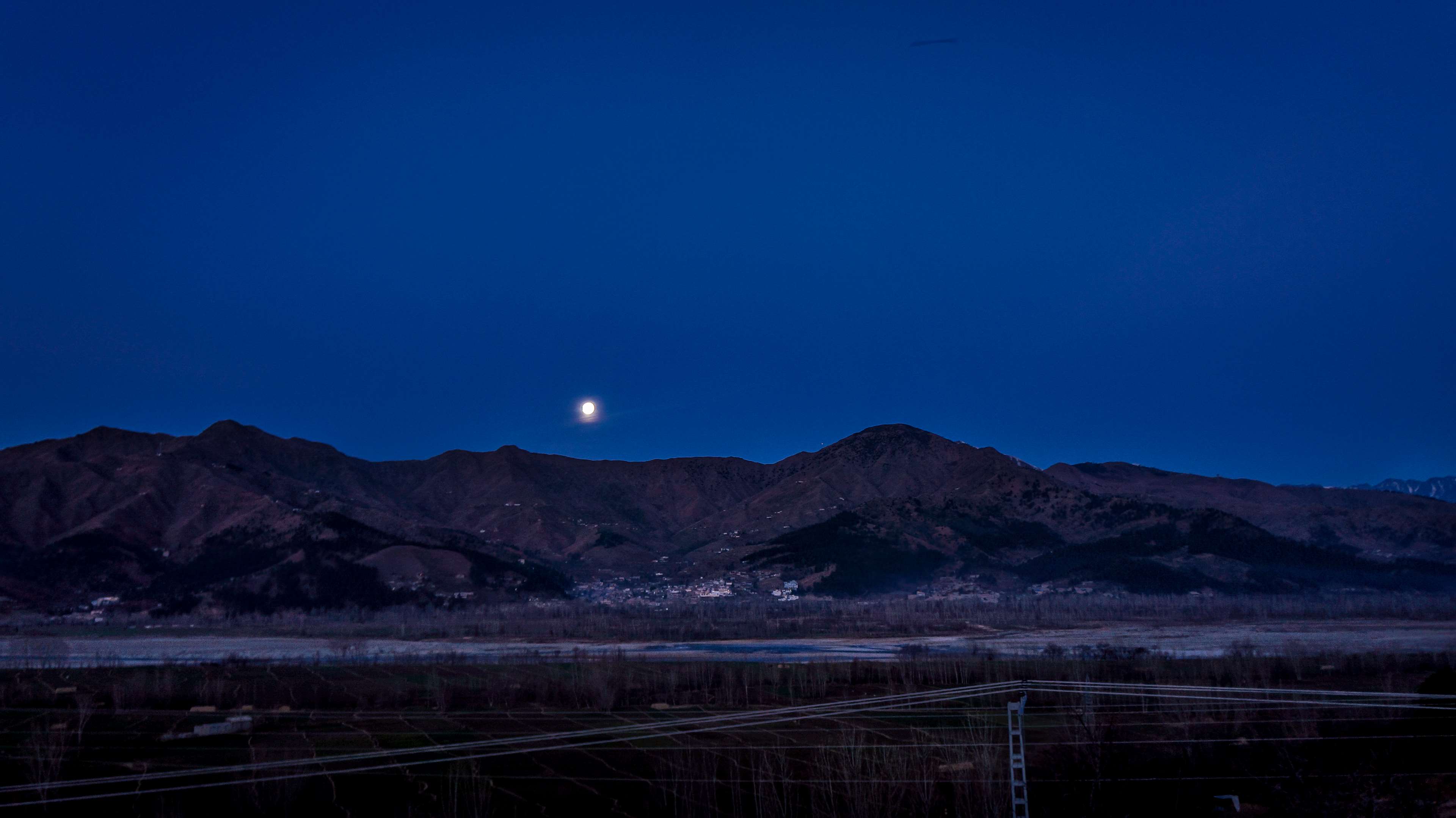 Moonlit mountain landscape at night 4K HD Wallpaper
