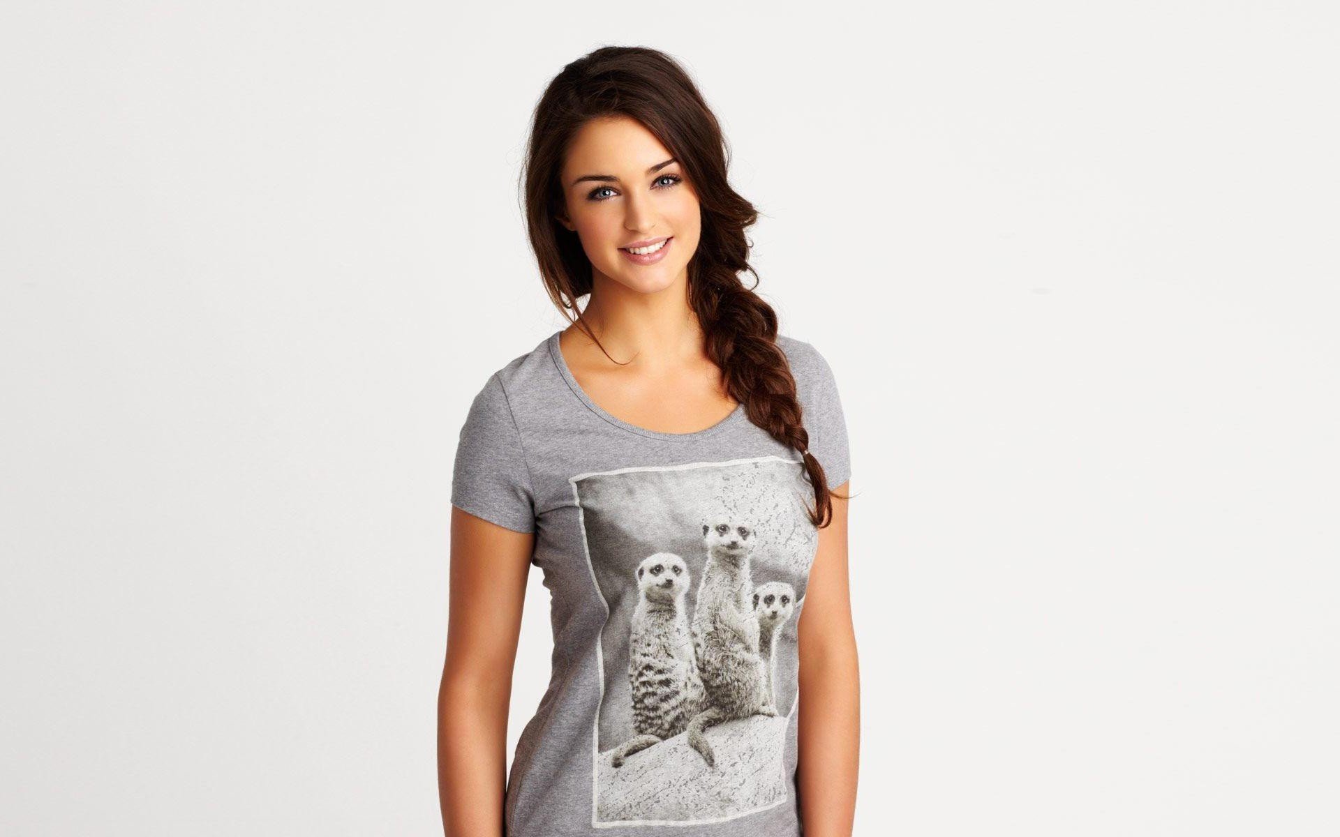Smiling blonde woman in meerkat print t-shirt HD Wallpaper