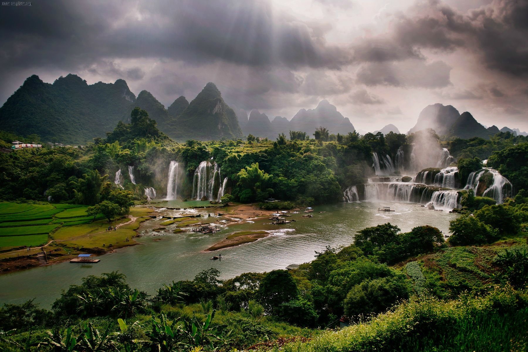Waterfalls and mountains with sunbeams HD Wallpaper