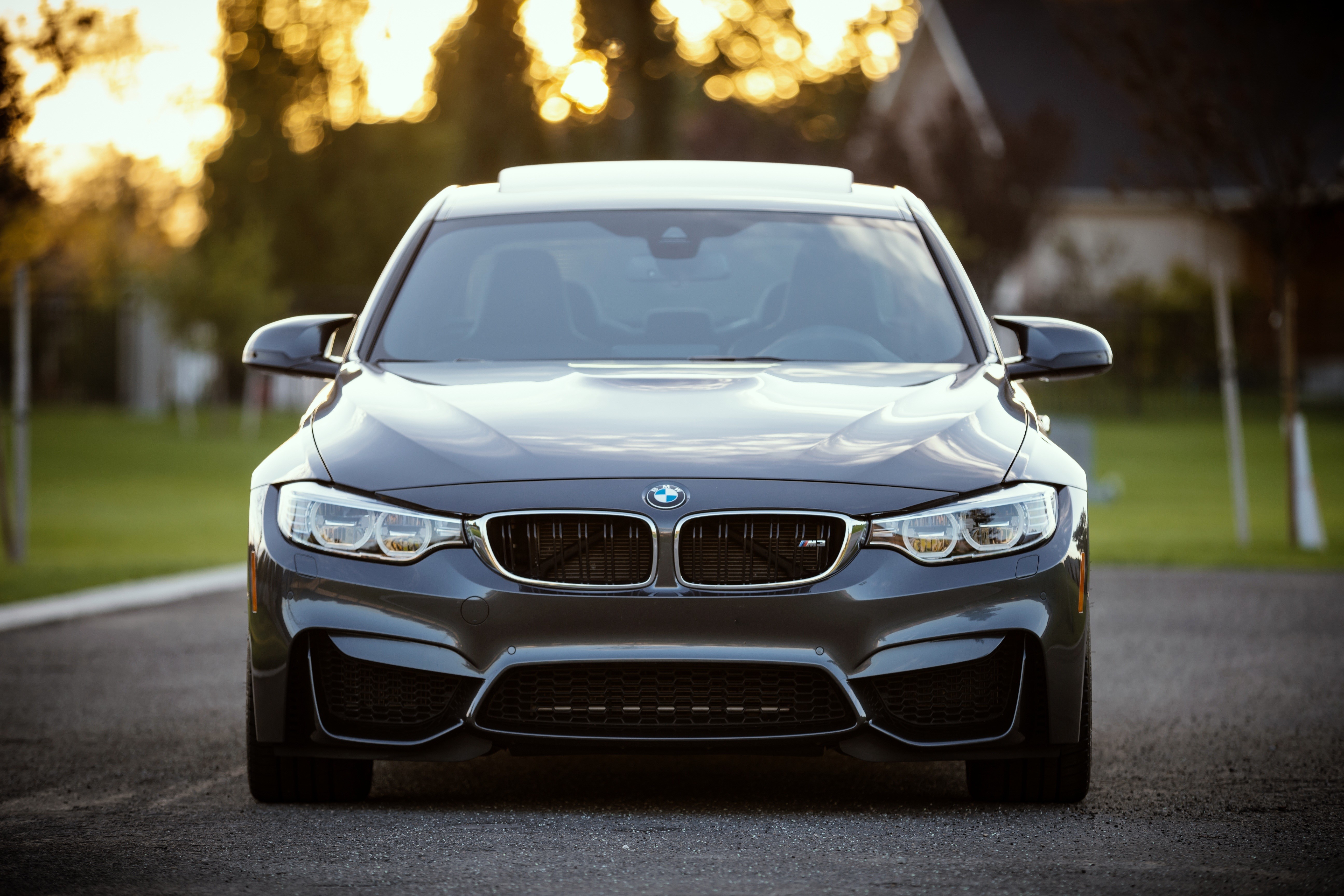 Front view of a dark gray BMW M4 HD Wallpaper