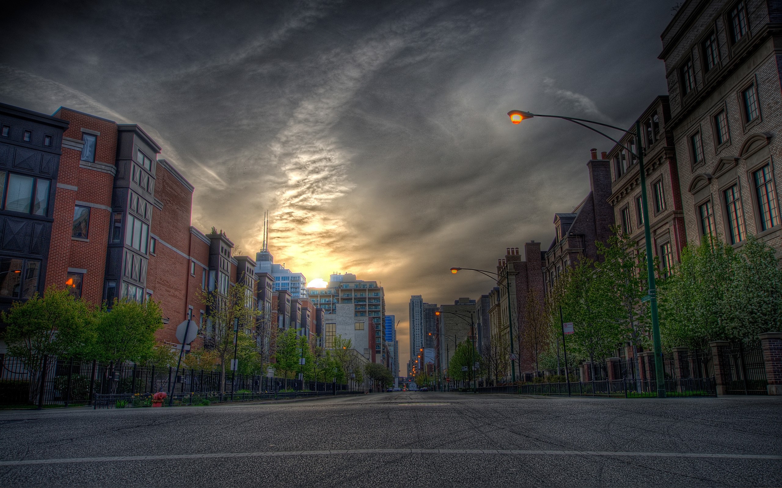 Street view of buildings and road at dusk HD Wallpaper
