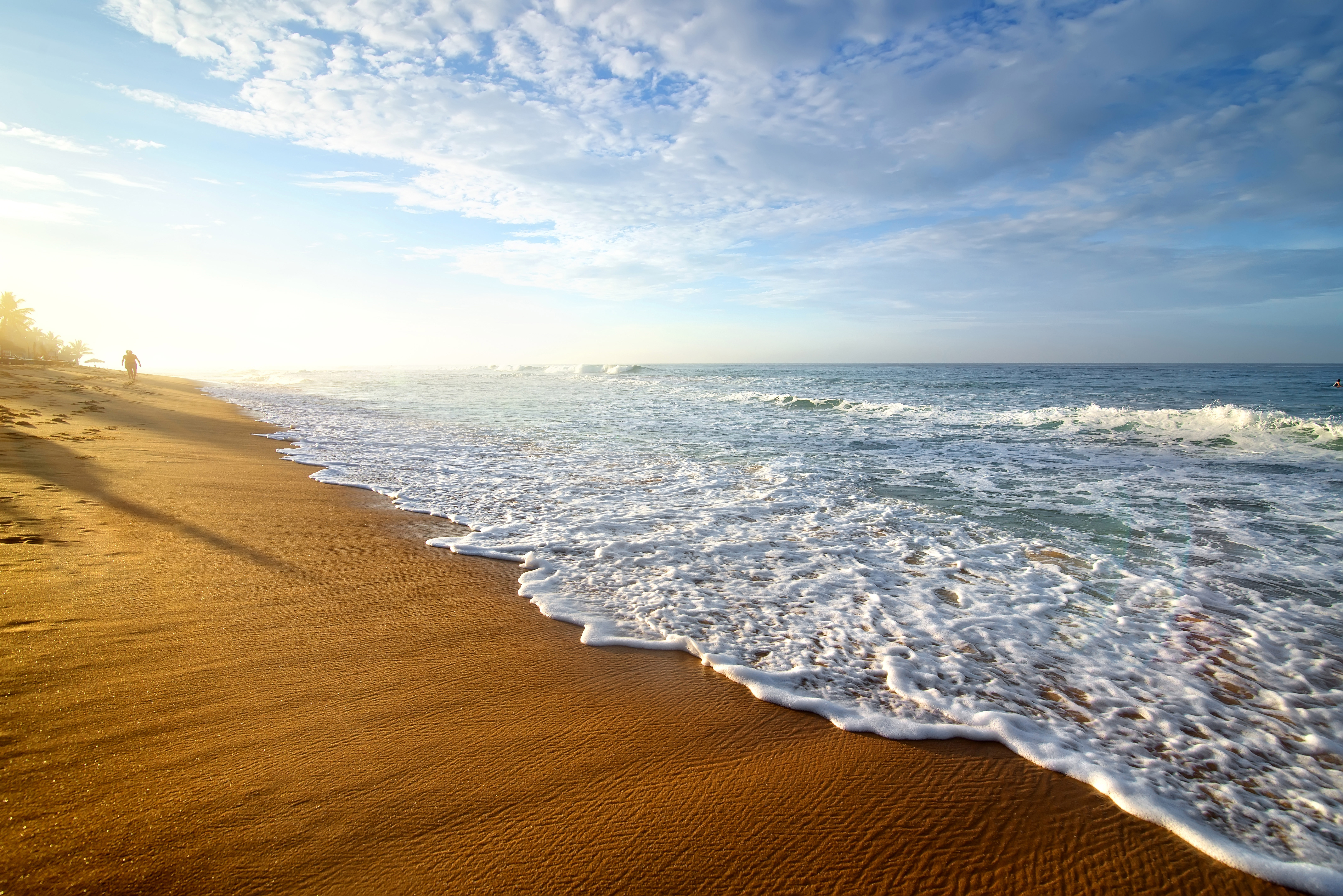Beach with waves and a person walking HD Wallpaper