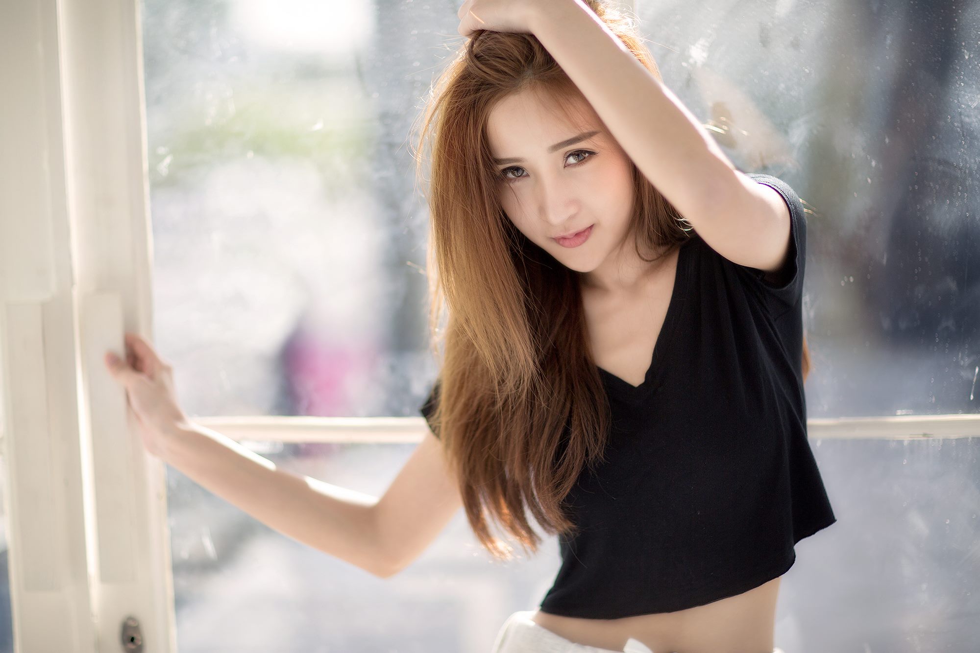 Asian model posing by a window HD Wallpaper