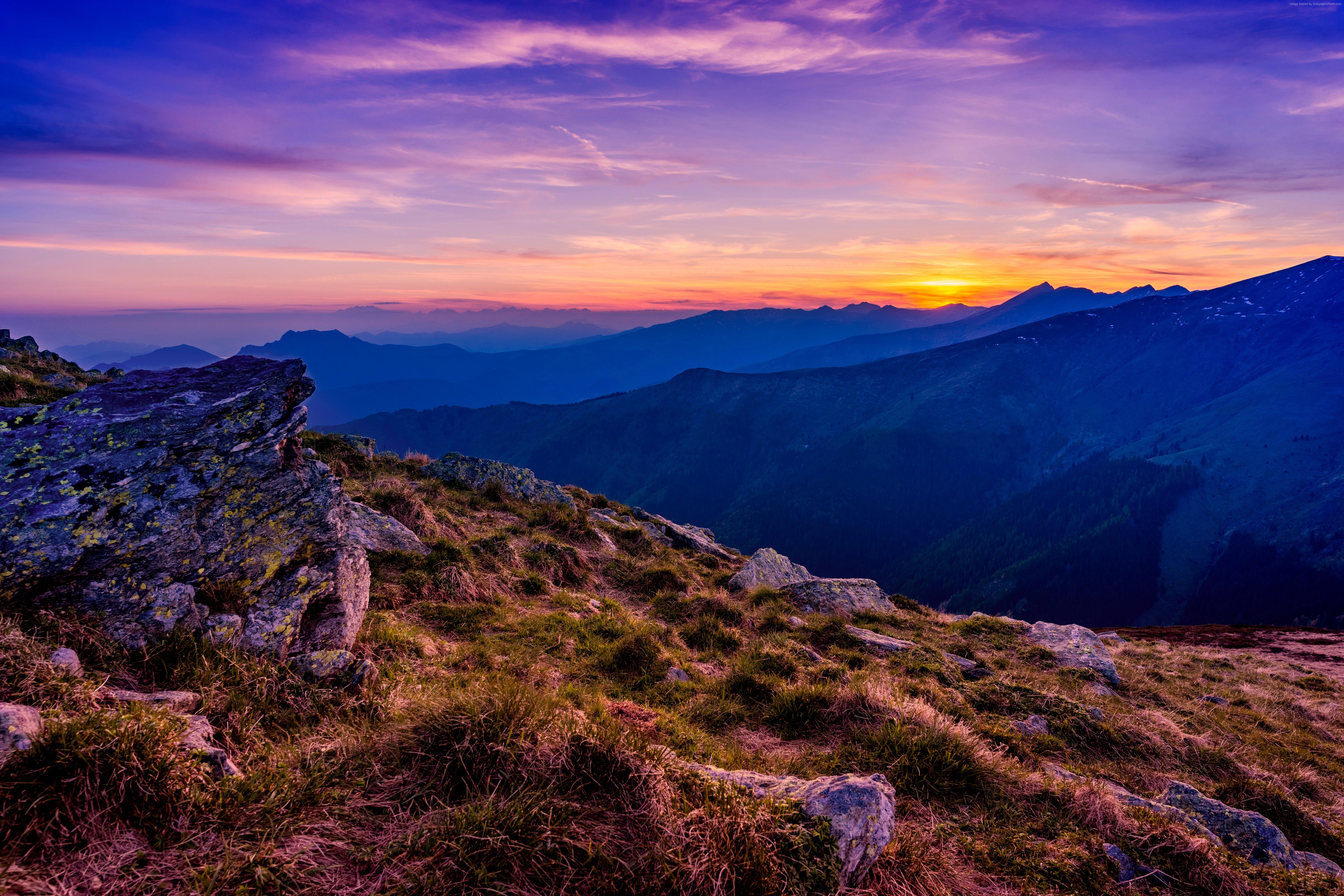 Mountains at sunset with purple and orange sky HD Wallpaper