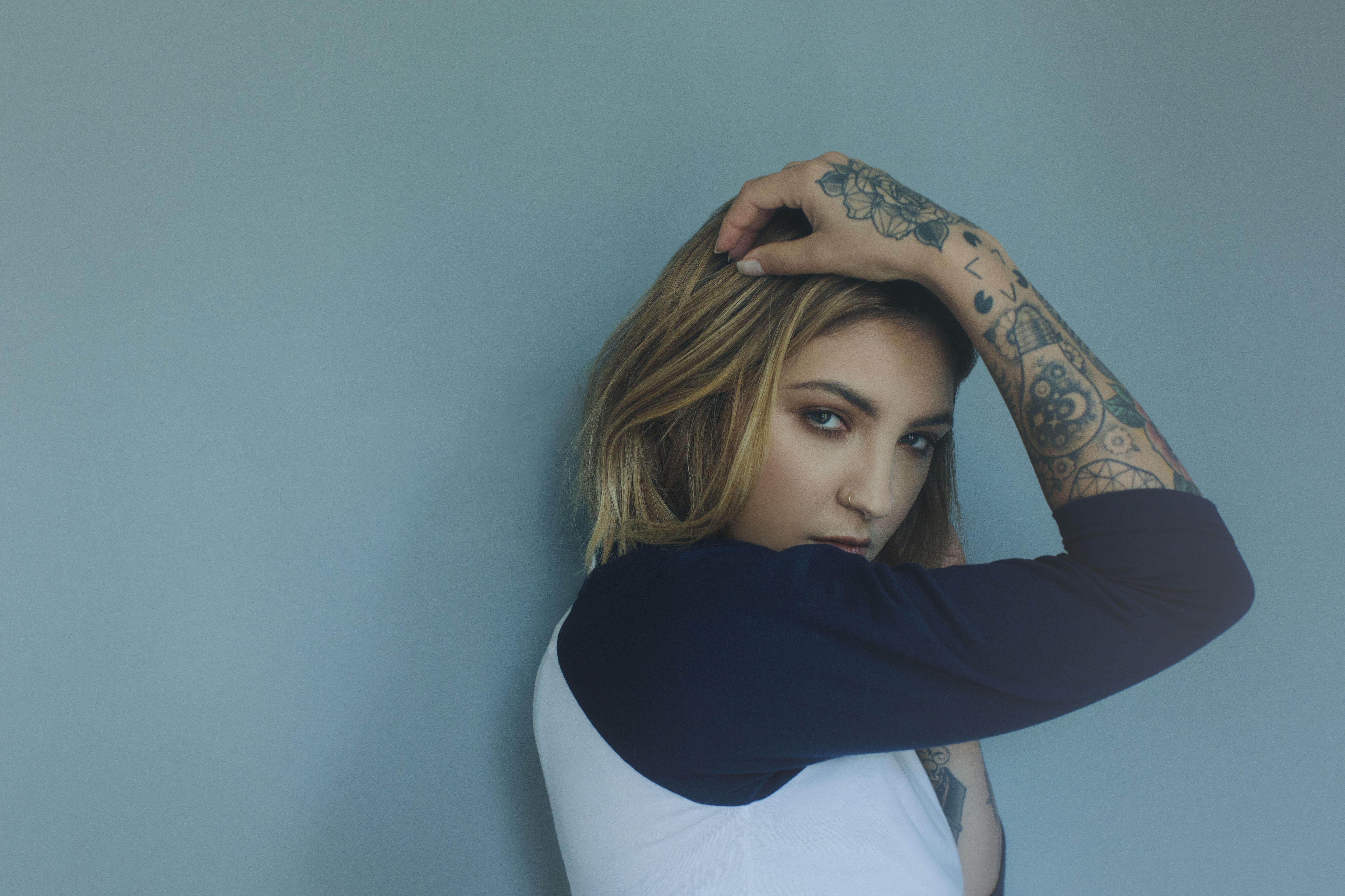 Woman with tattoos and blonde hair HD Wallpaper