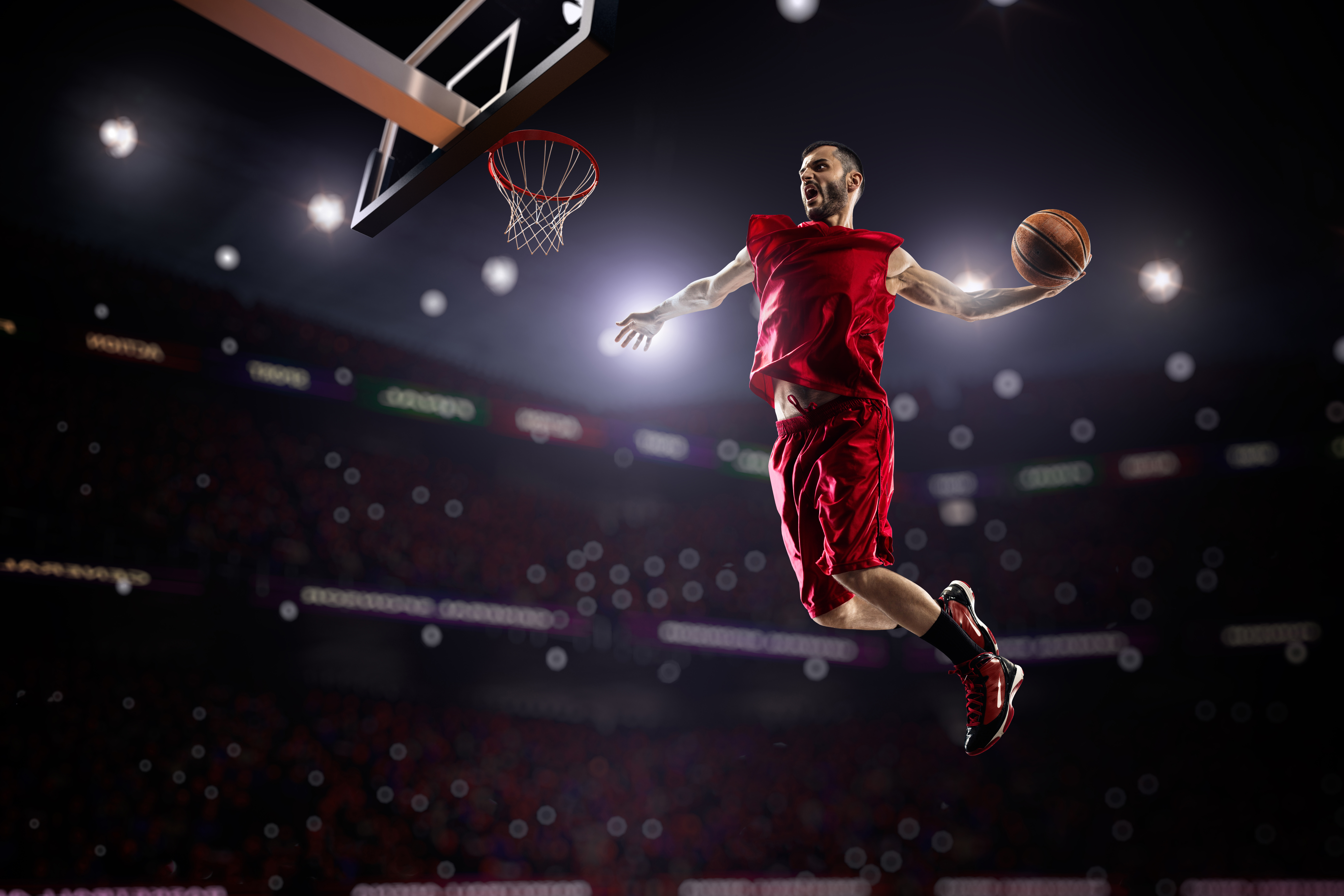 Basketball player dunking in a stadium HD Wallpaper