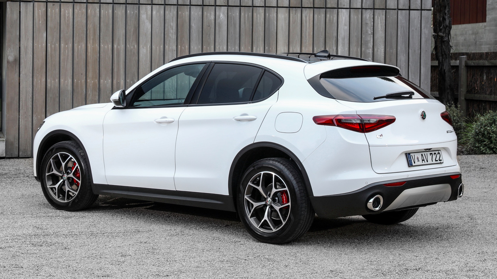 White Alfa Romeo Stelvio SUV parked outdoors HD Wallpaper
