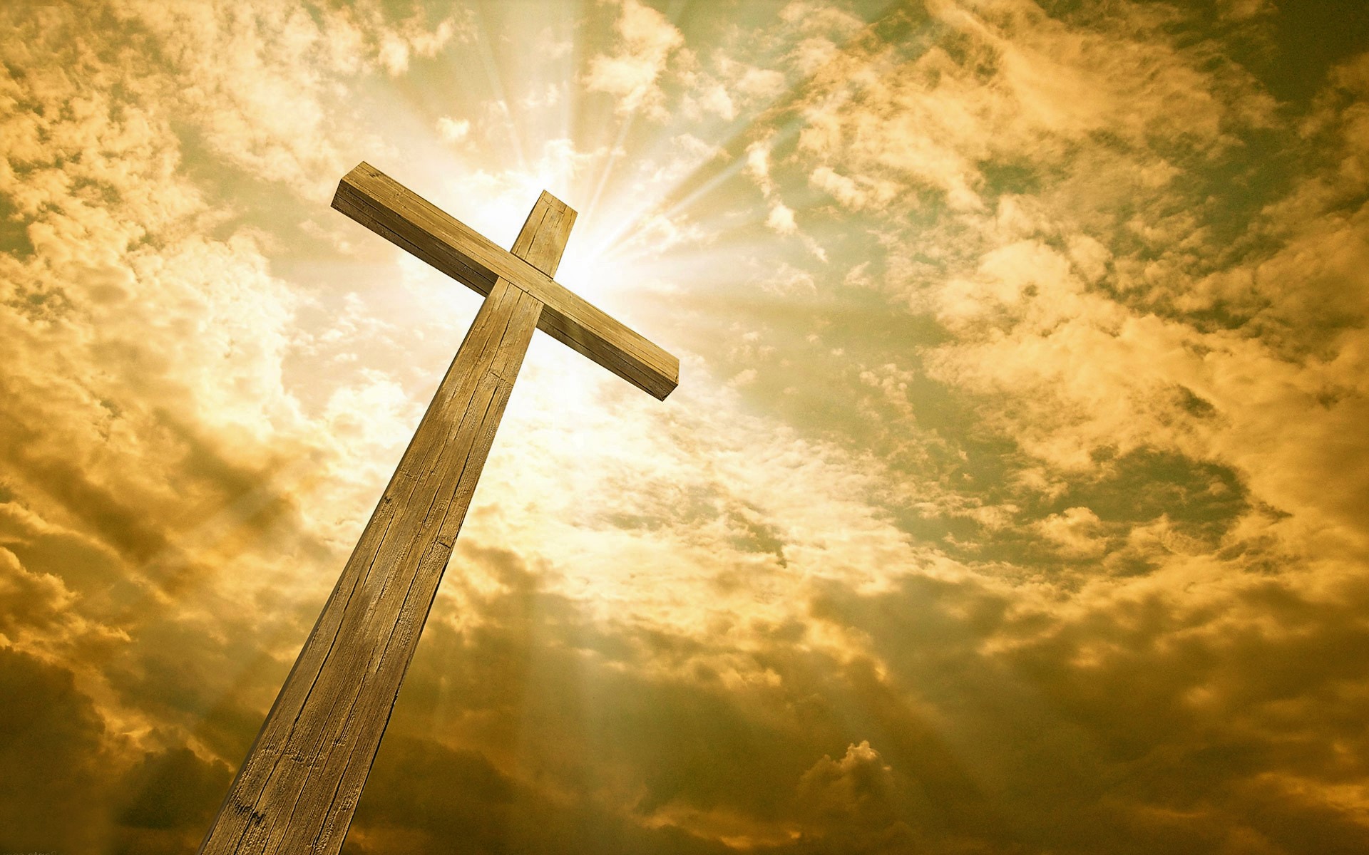 Wooden cross against a cloudy sky with sunbeams HD Wallpaper