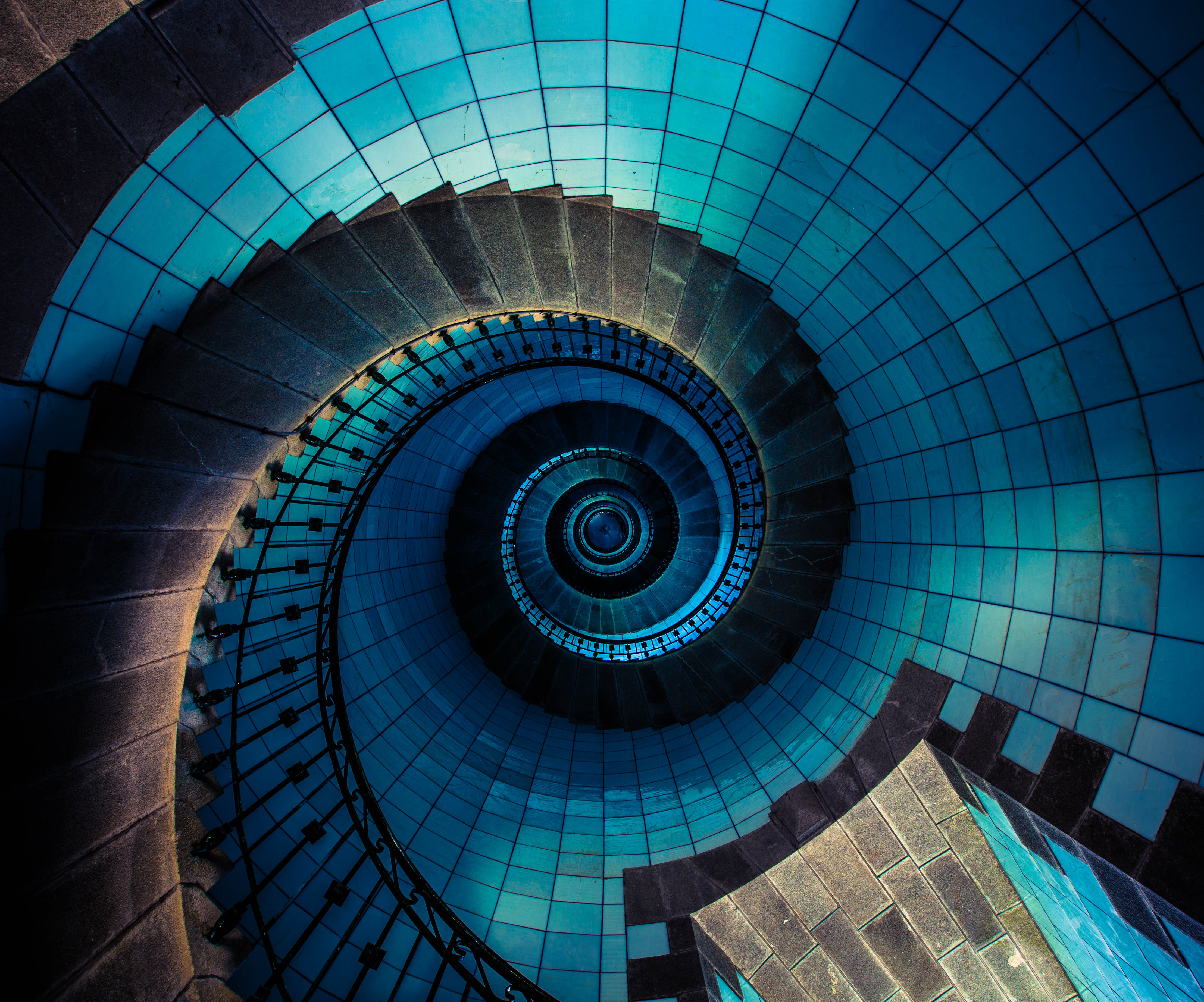 Spiral Staircase with Blue Tiled Walls HD Wallpaper