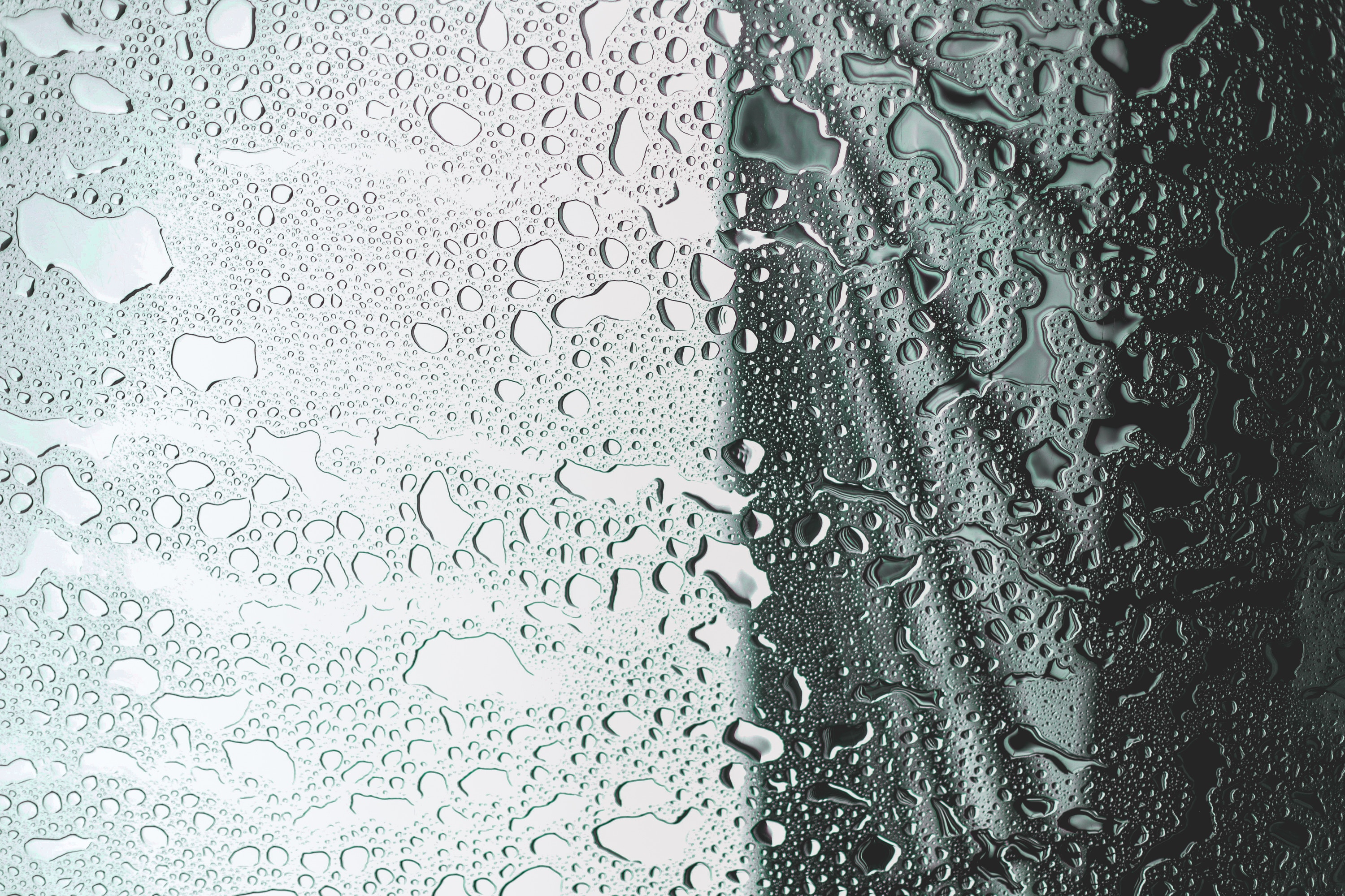 Water drops on a window pane HD Wallpaper