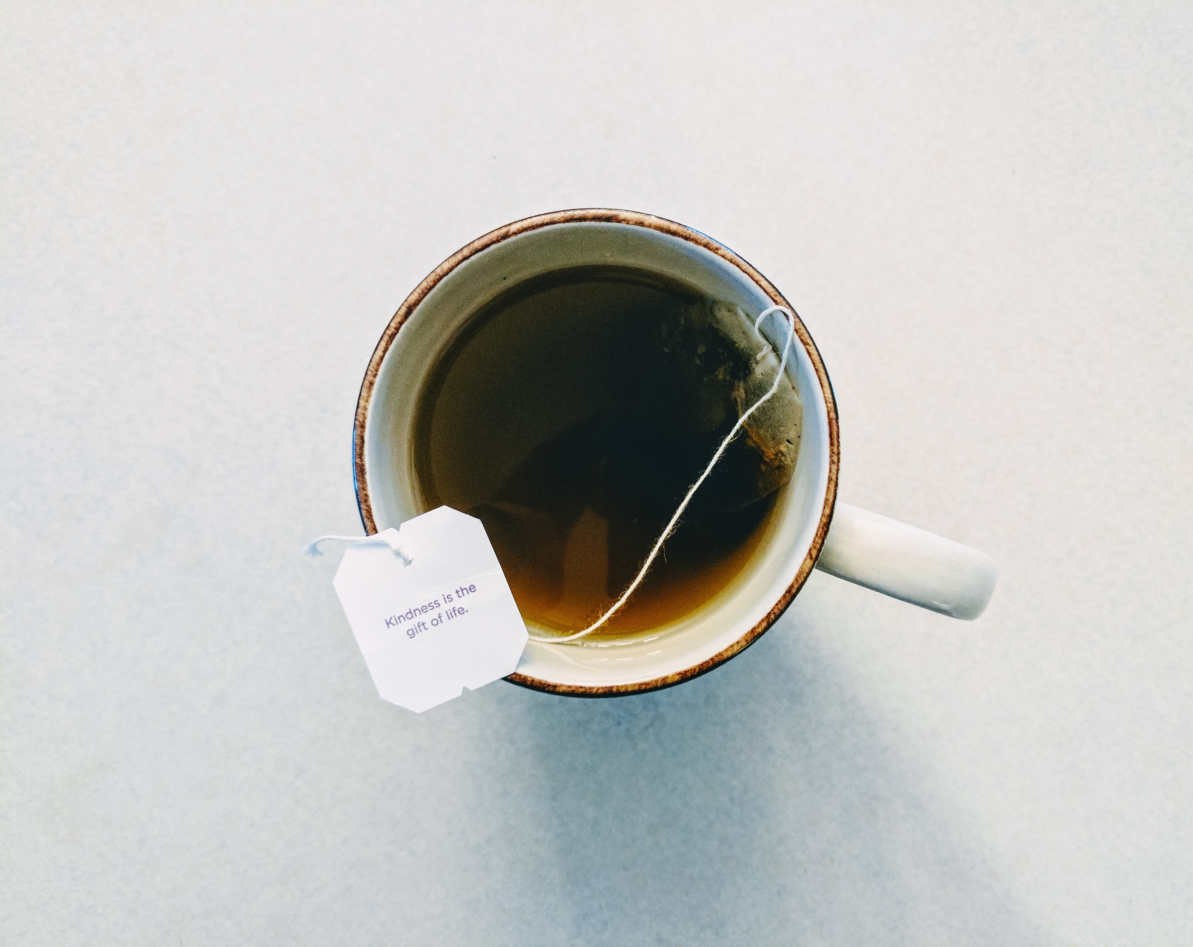 Tea bag with message in a mug of tea HD Wallpaper