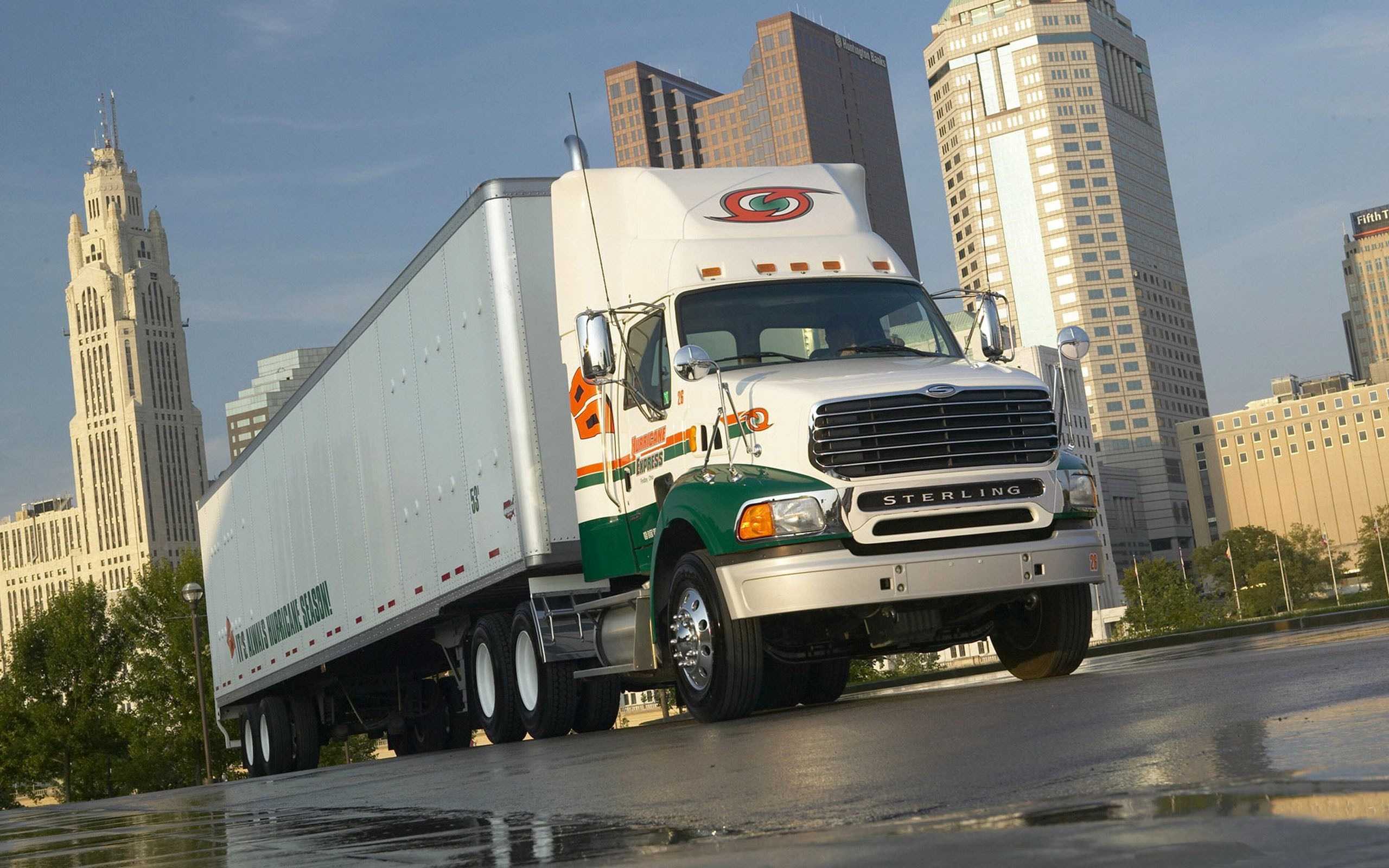 Sterling truck with trailer in city HD Wallpaper