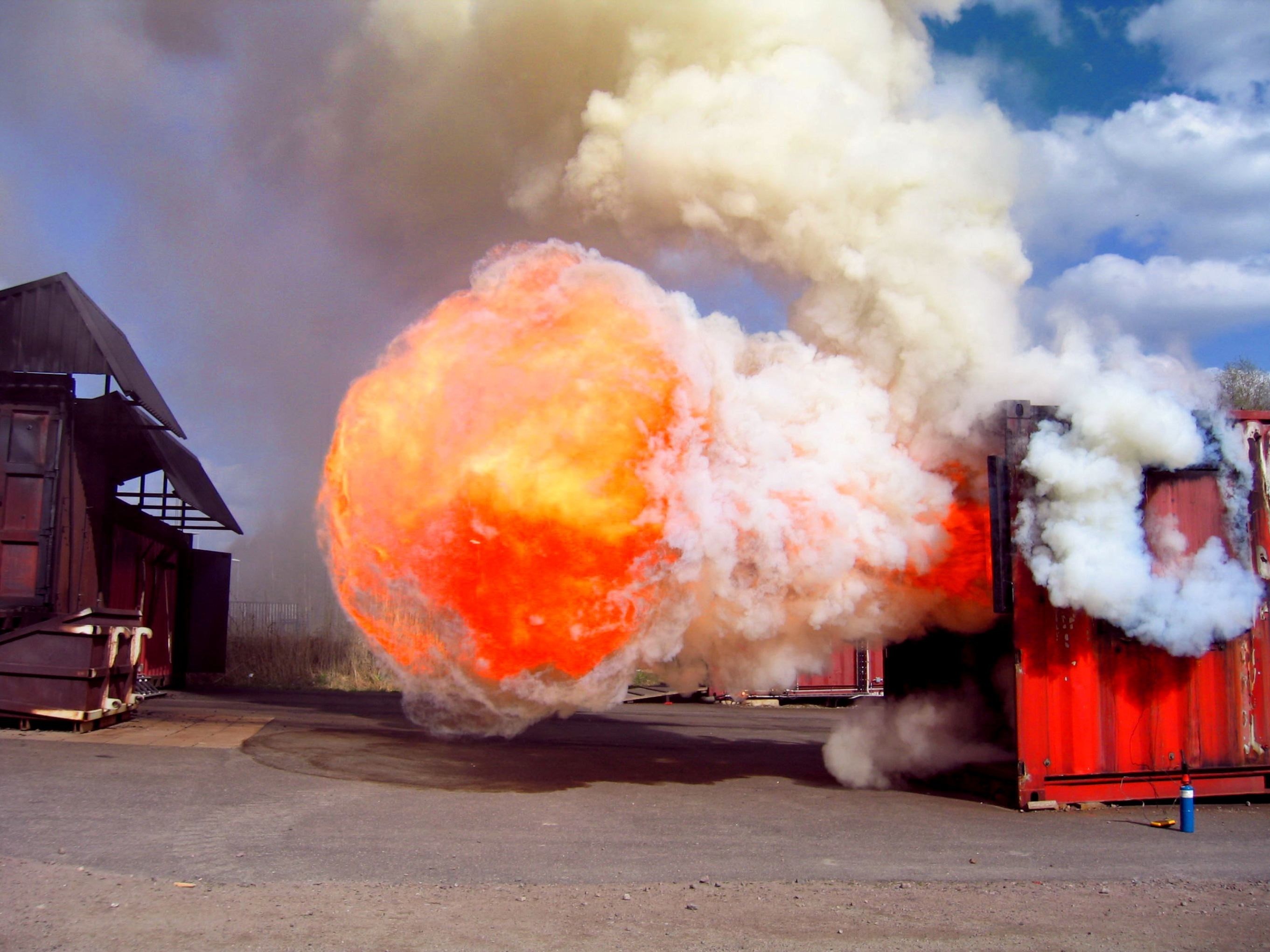 Explosion from a shipping container HD Wallpaper