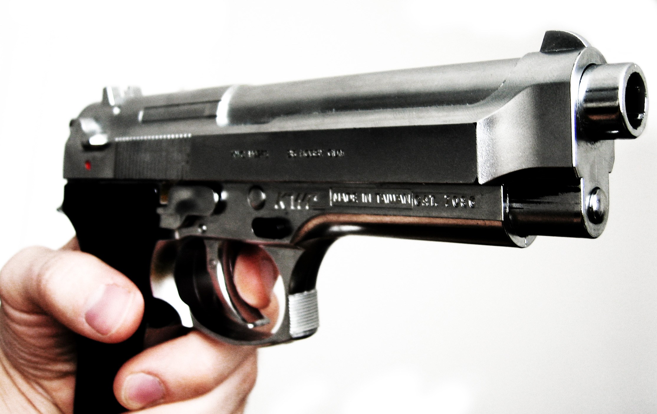 Hand holding a silver pistol HD Wallpaper