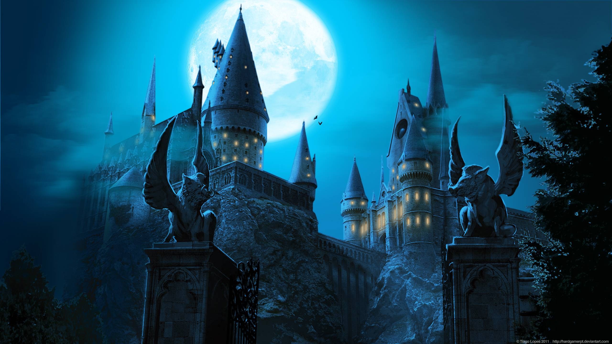 Hogwarts Castle under a full moon HD Wallpaper