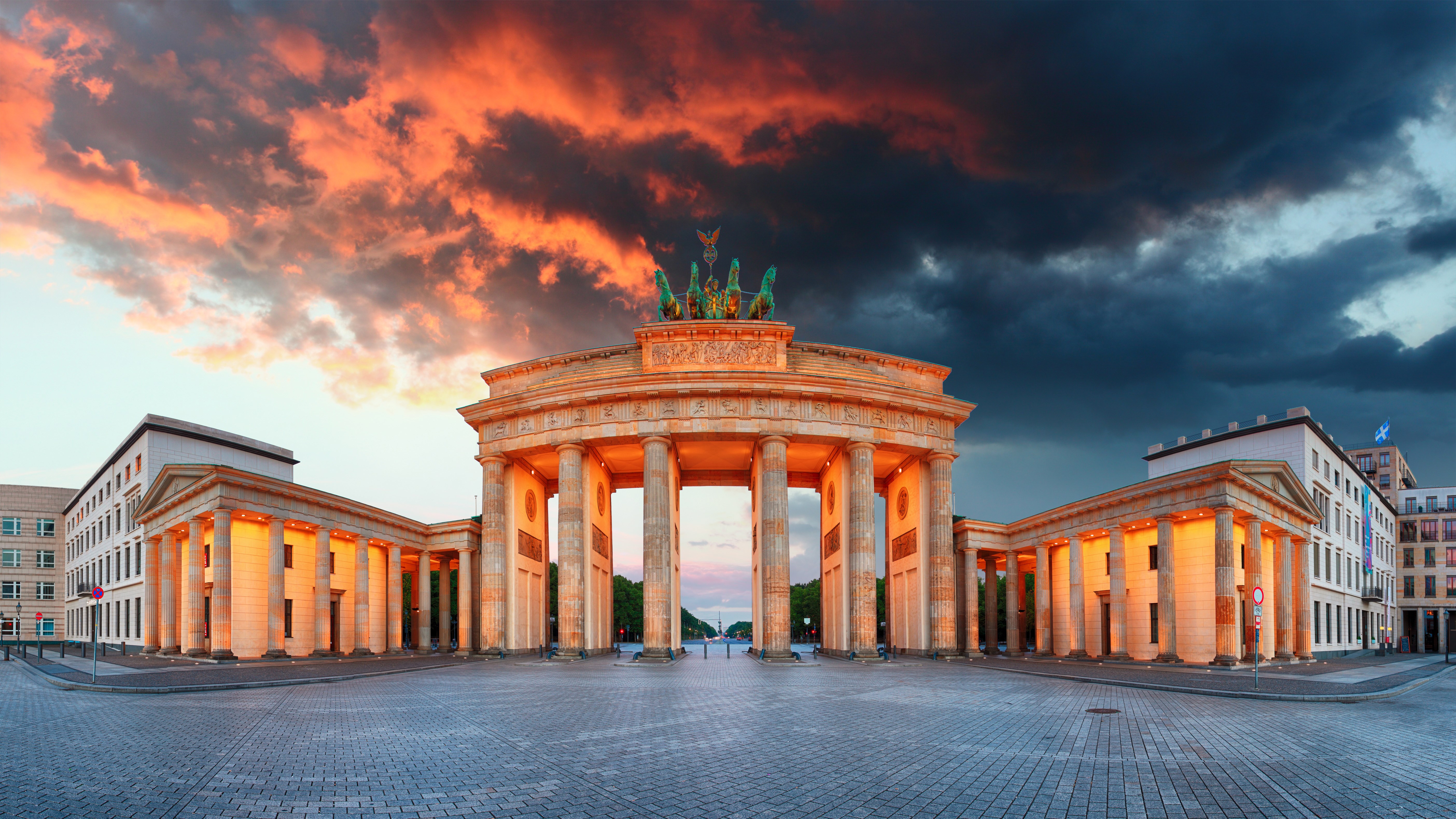 Brandenburg Gate at sunset with dramatic clouds HD Wallpaper