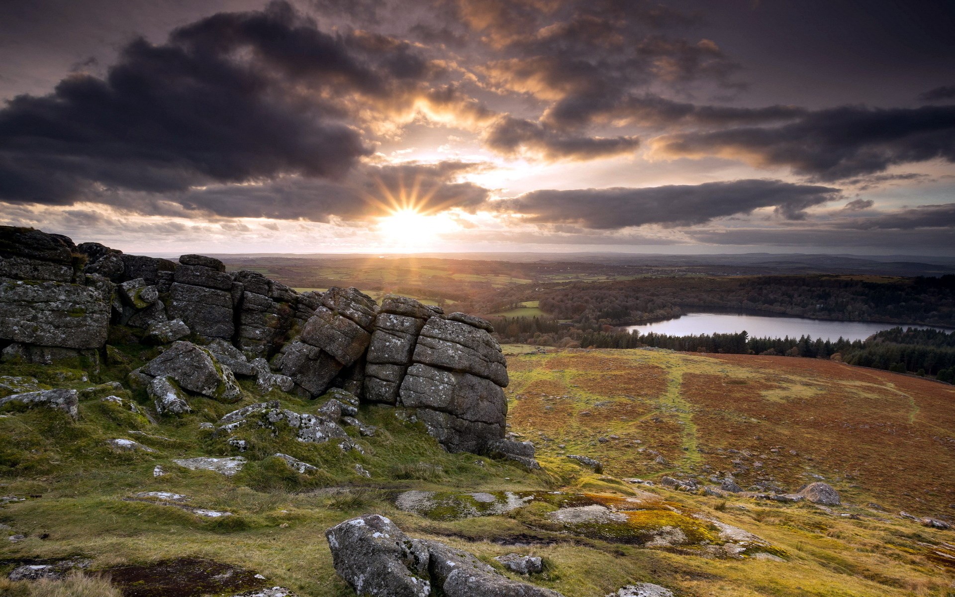 Sunset over rocky hills and a lake HD Wallpaper
