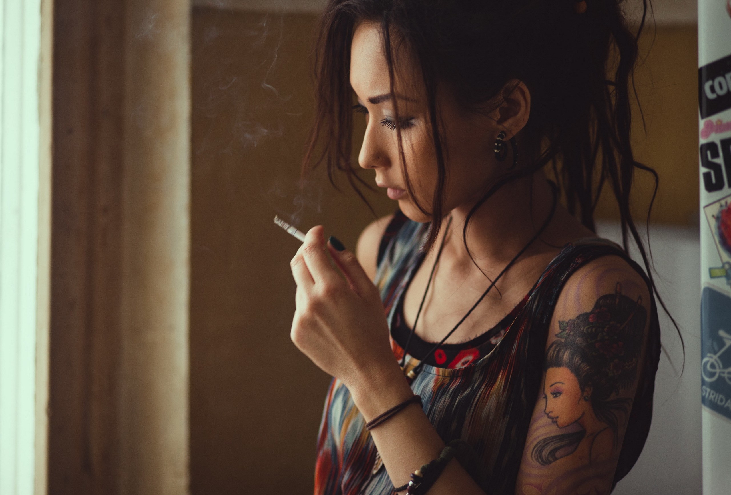 Woman smoking near window HD Wallpaper