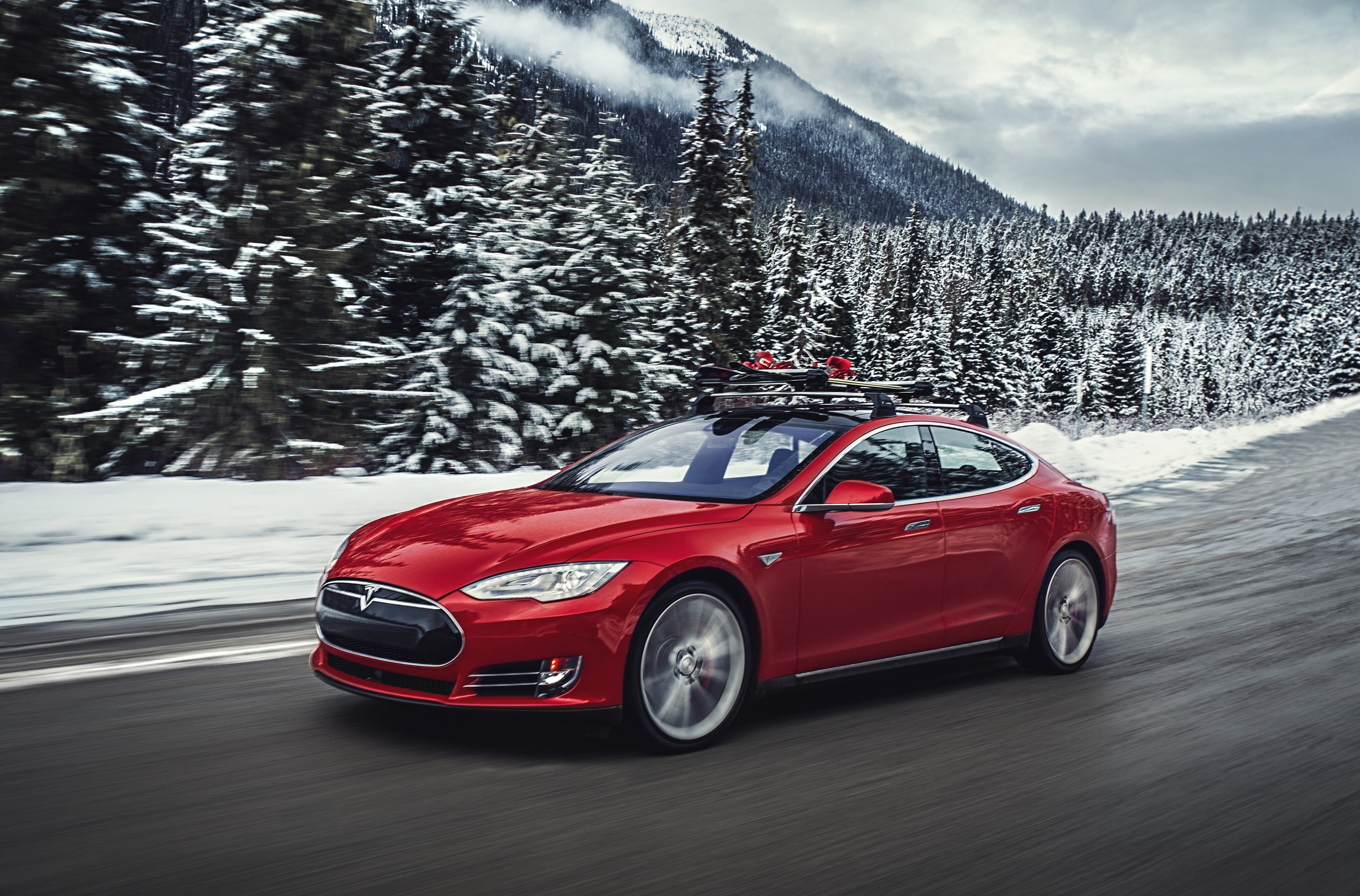 Red Tesla Model S P85D with skis on roof rack HD Wallpaper