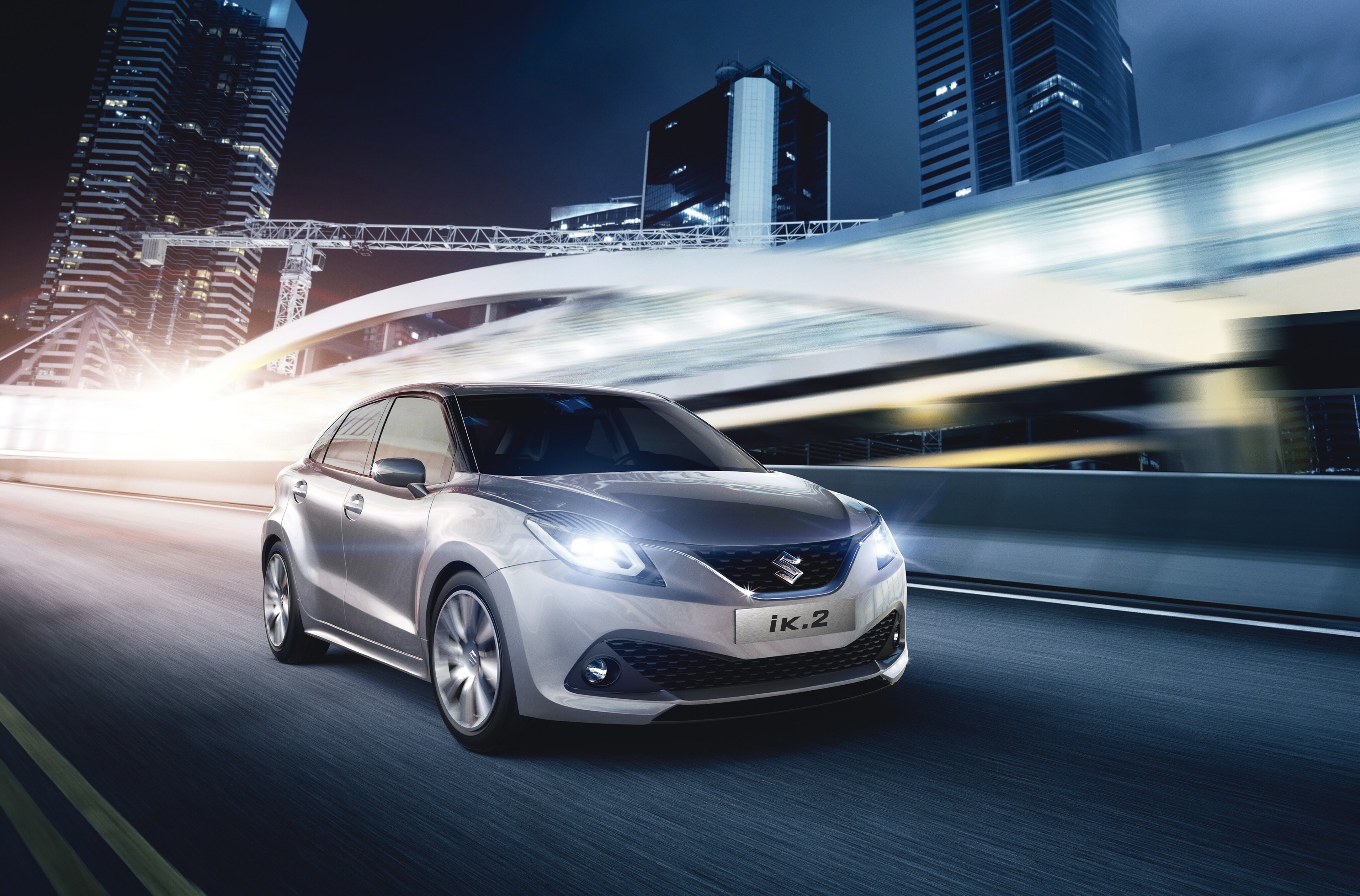 Suzuki iK.2 driving on a city road at night HD Wallpaper