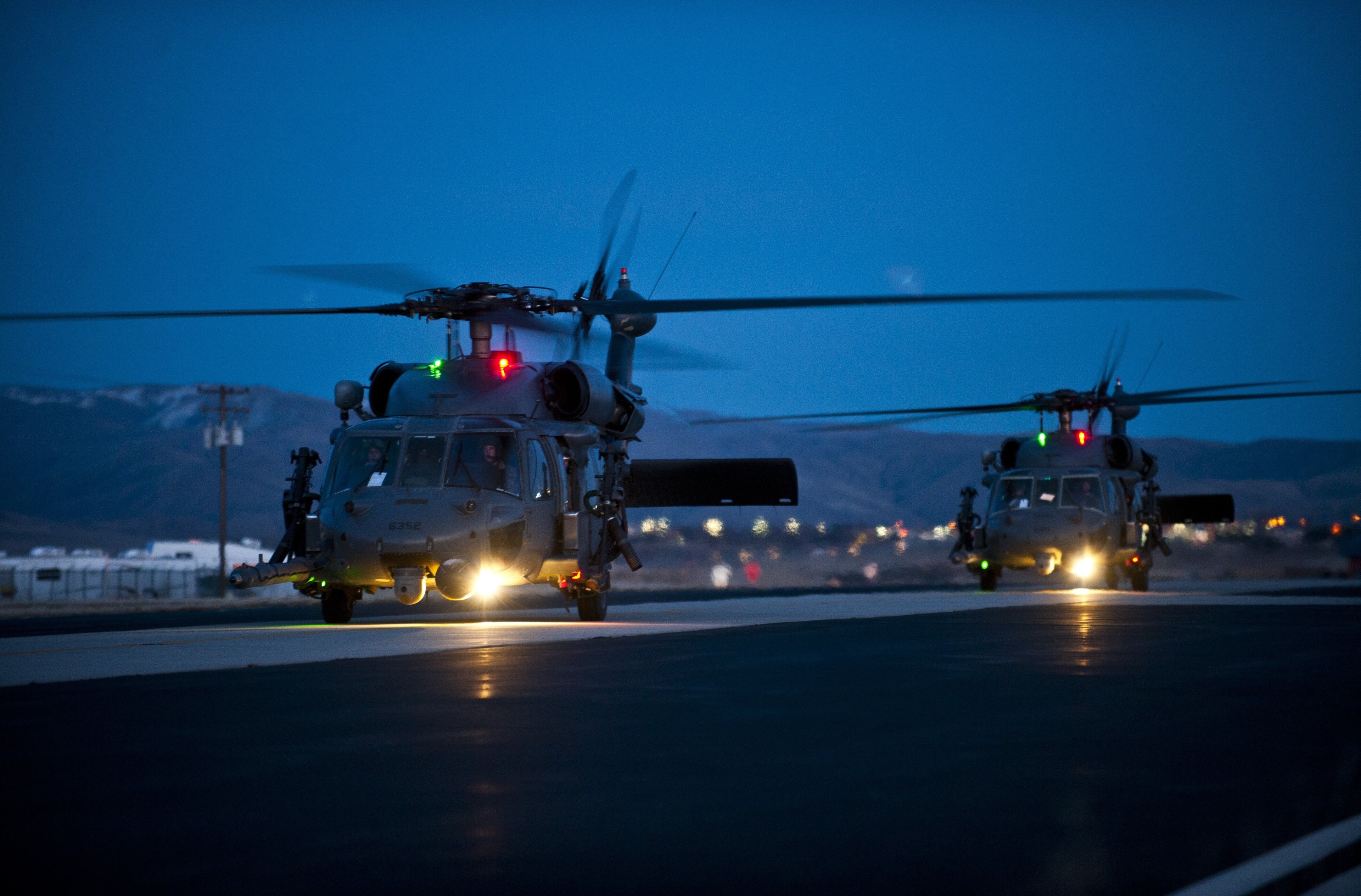 Sikorsky UH-60 Black Hawk helicopters at dusk HD Wallpaper