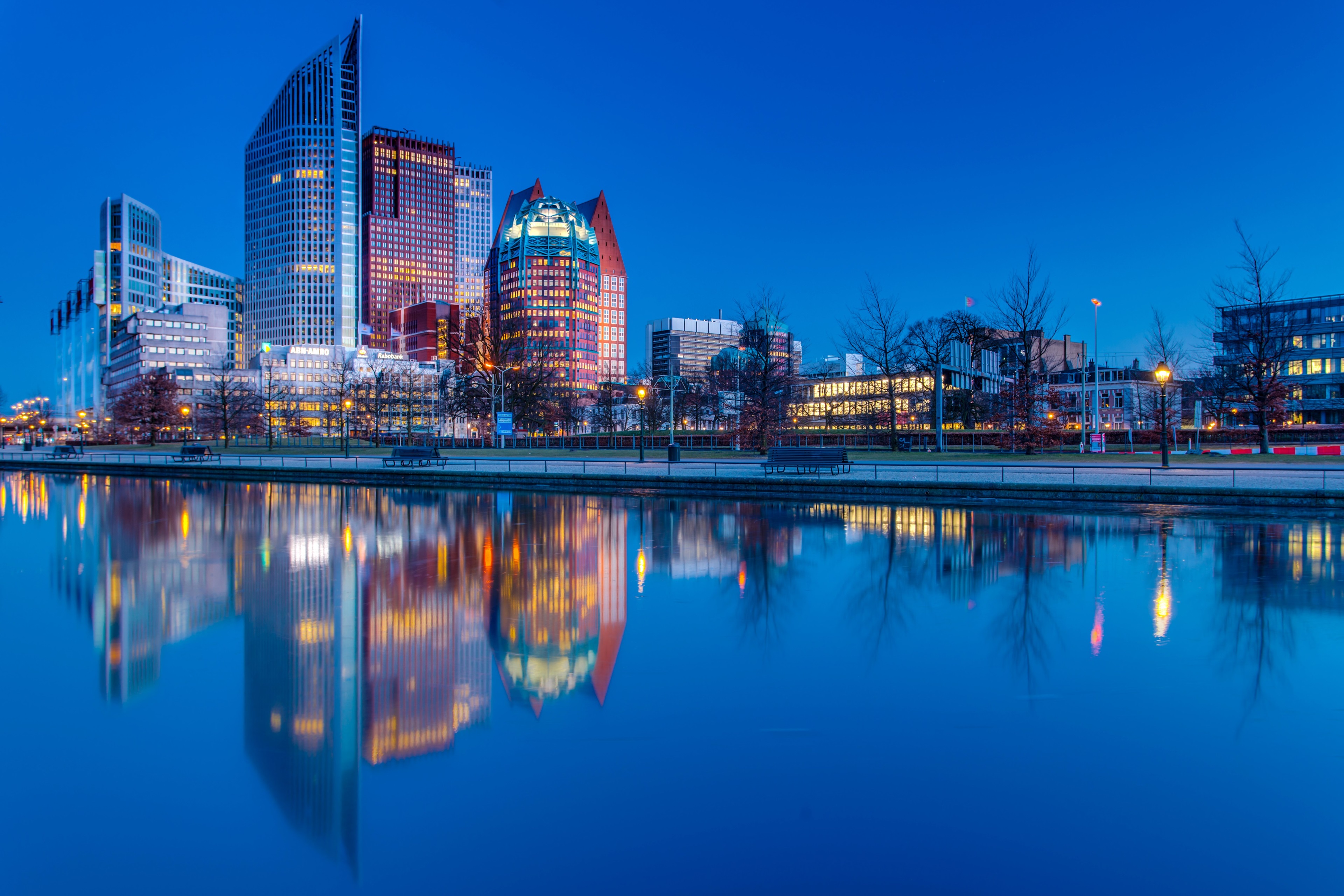 The Hague skyline reflected in water at dusk 4K HD Wallpaper