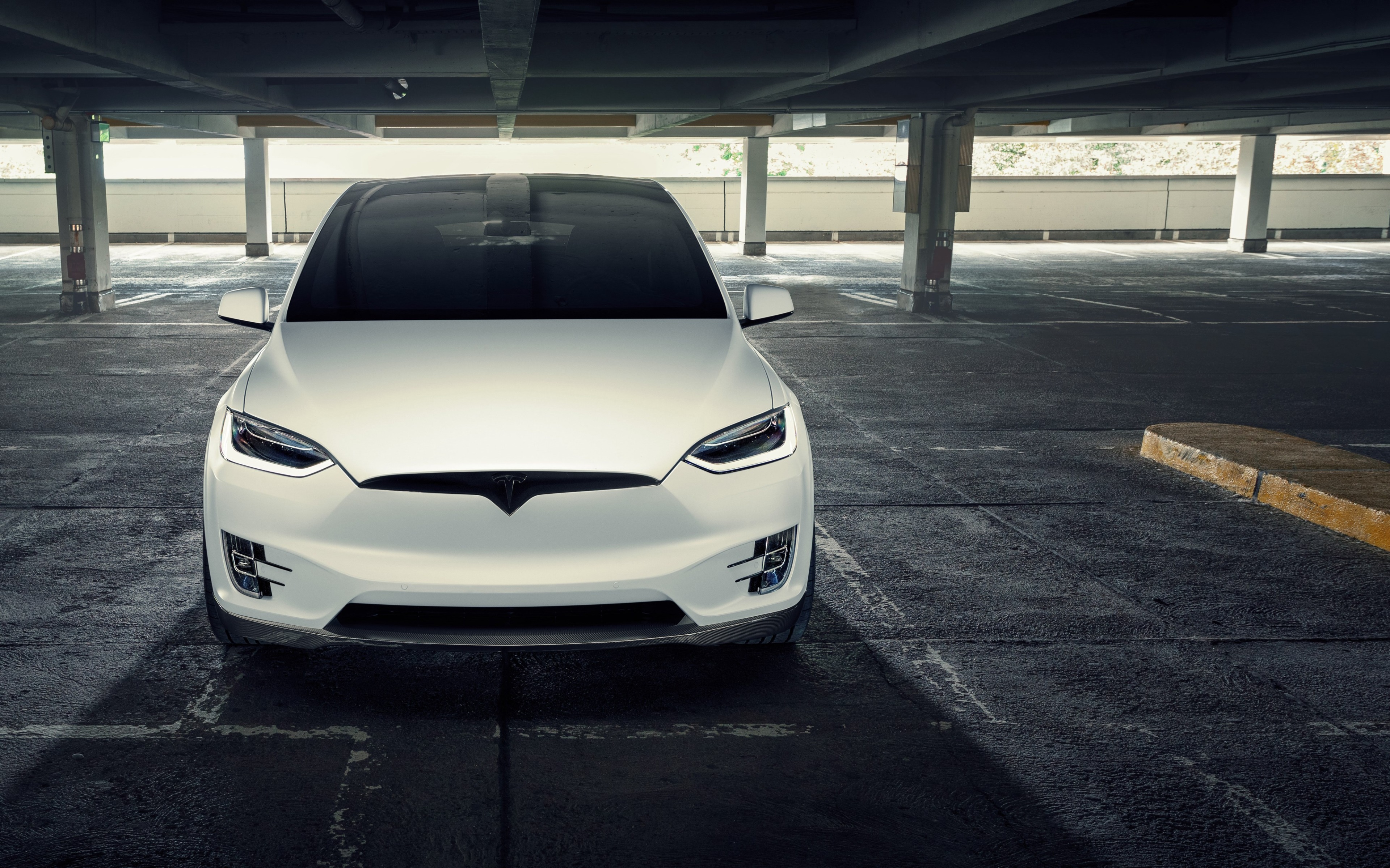 White Tesla Model X parked in a parking garage HD Wallpaper
