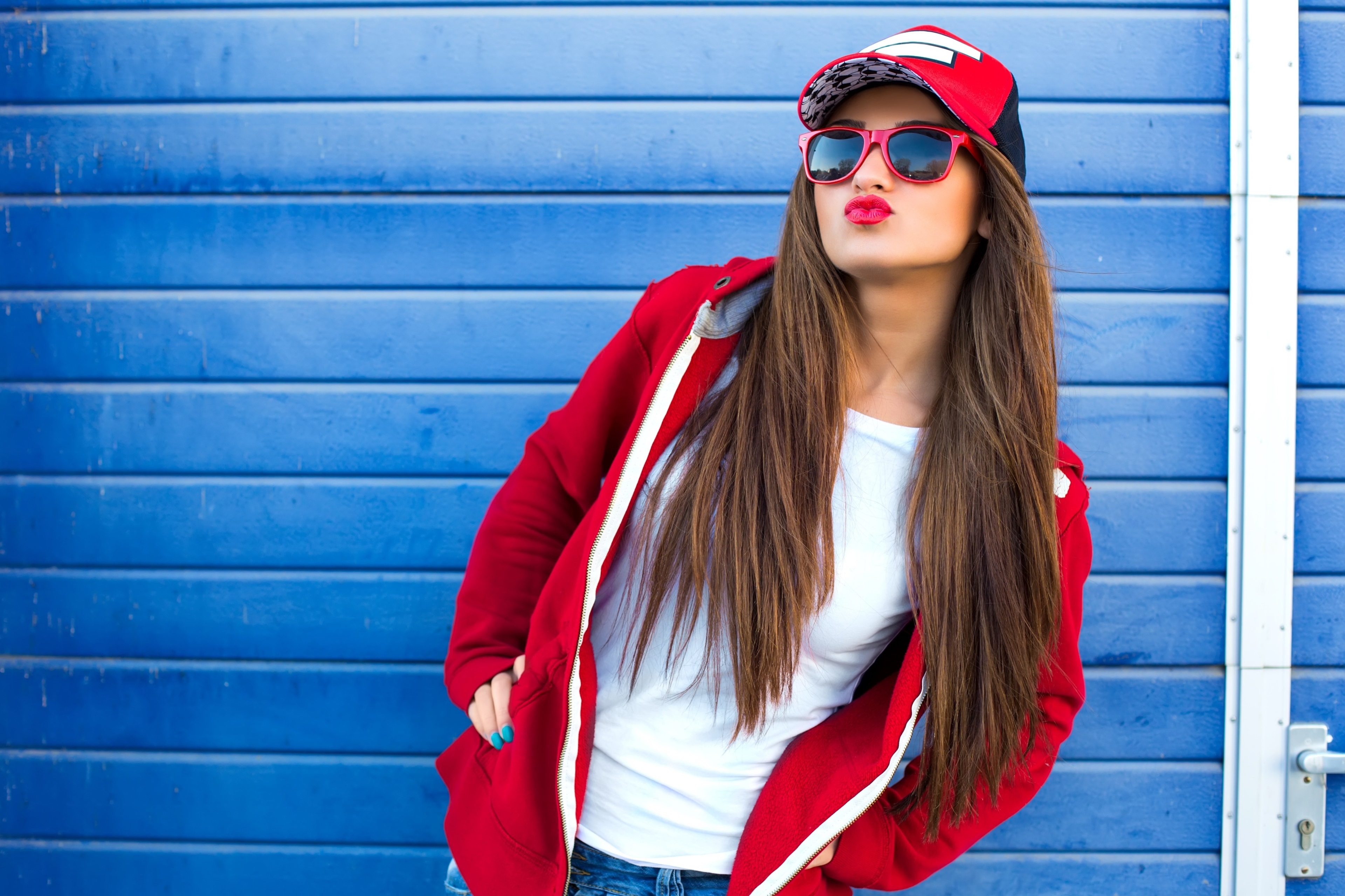 Stylish Young Woman in Red Hoodie and Sunglasses 4K HD Wallpaper