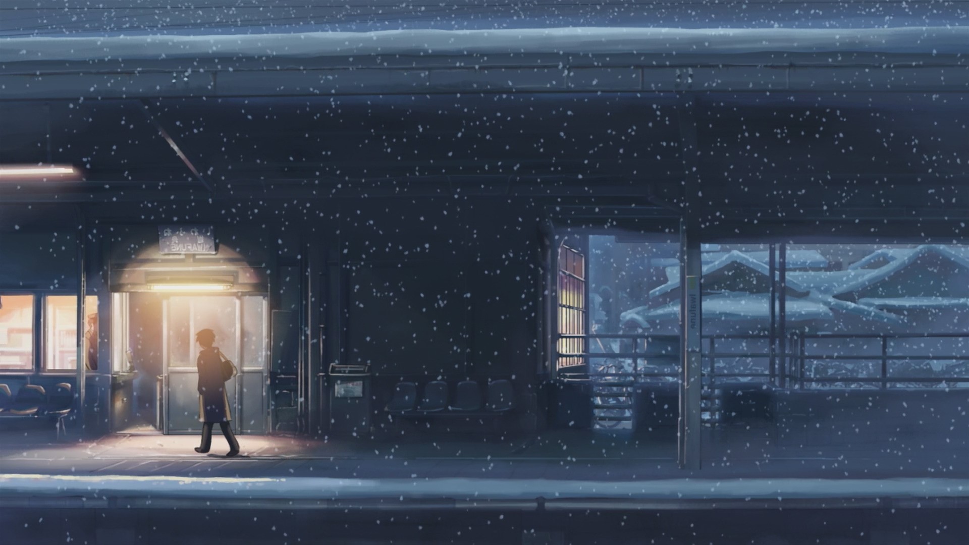 Person walking at a snowy train station HD Wallpaper