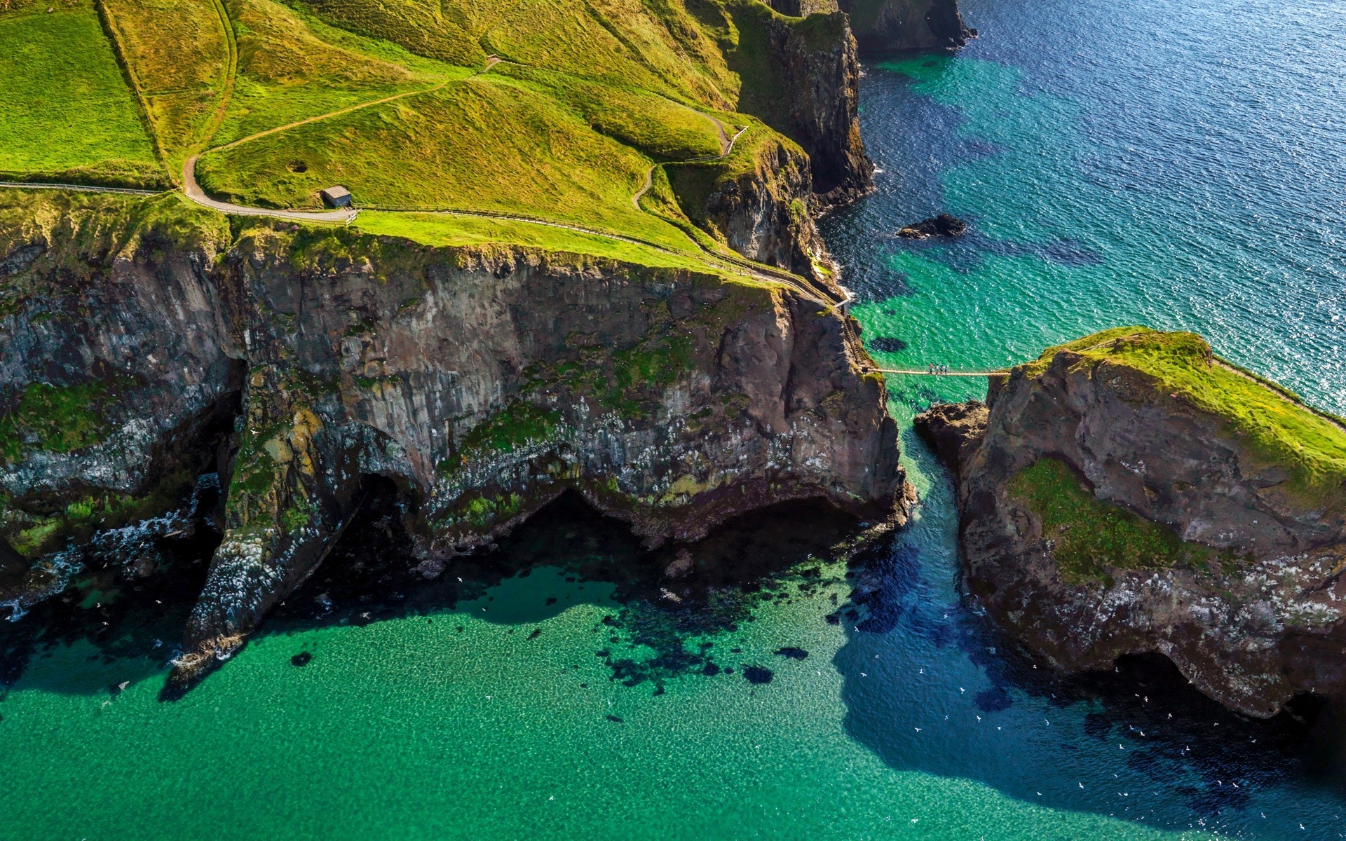 Aerial View of Cliff Bridge Over Irish Coastal Waters HD Wallpaper