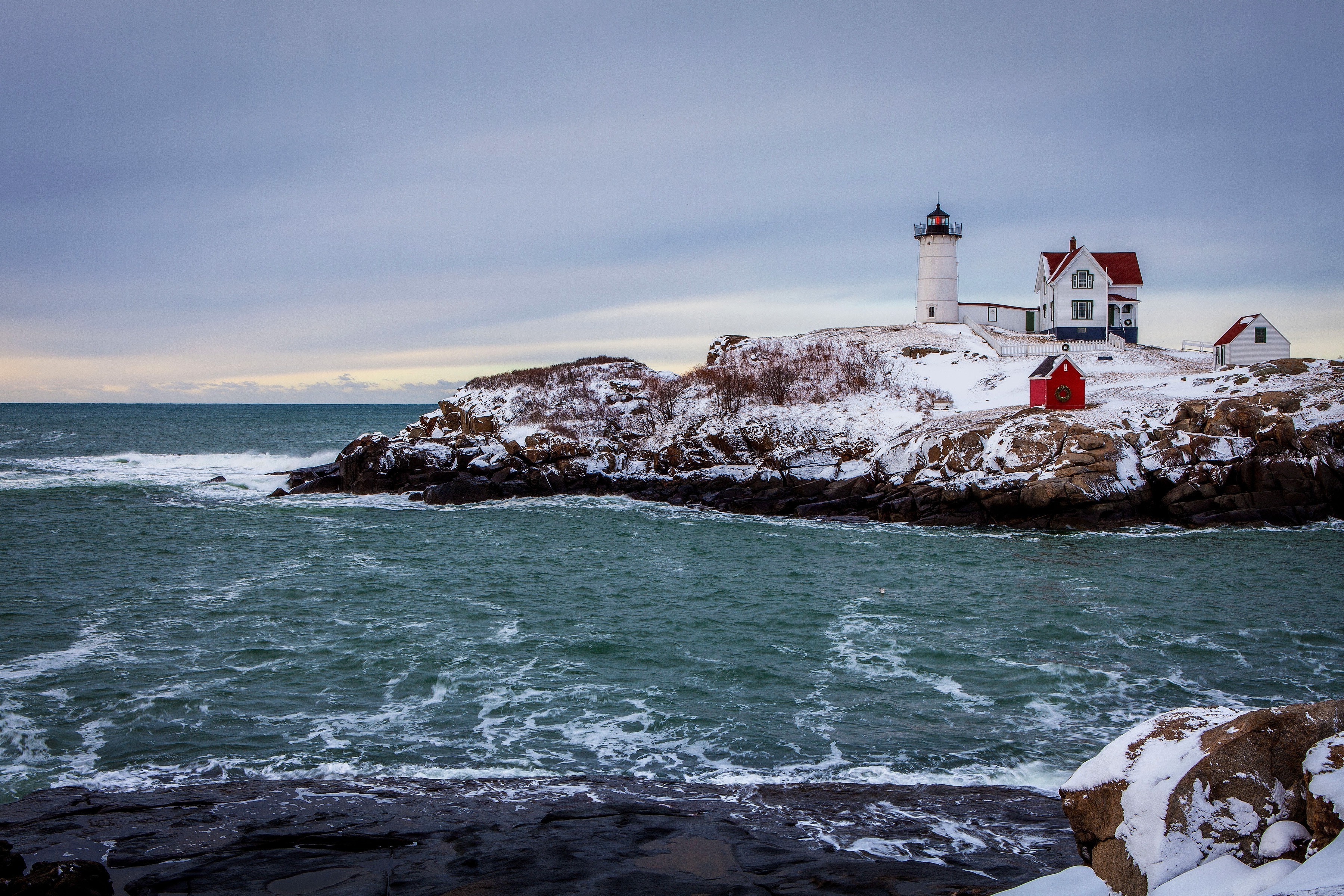 Nubble Lighthouse on a Snowy Winter Day HD Wallpaper