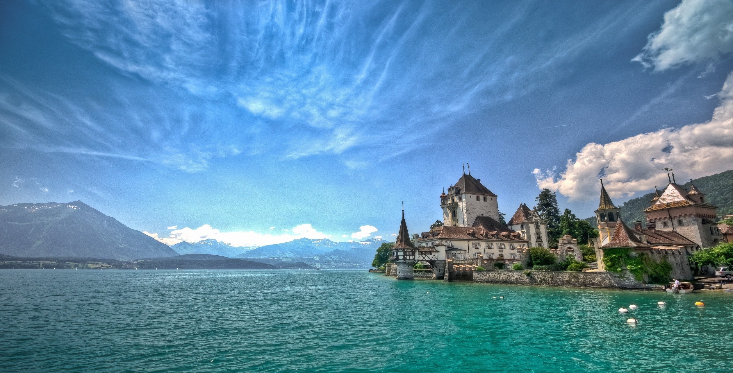Castle on Lake Thun with Mountains and Clouds in Switzerland HD Wallpaper