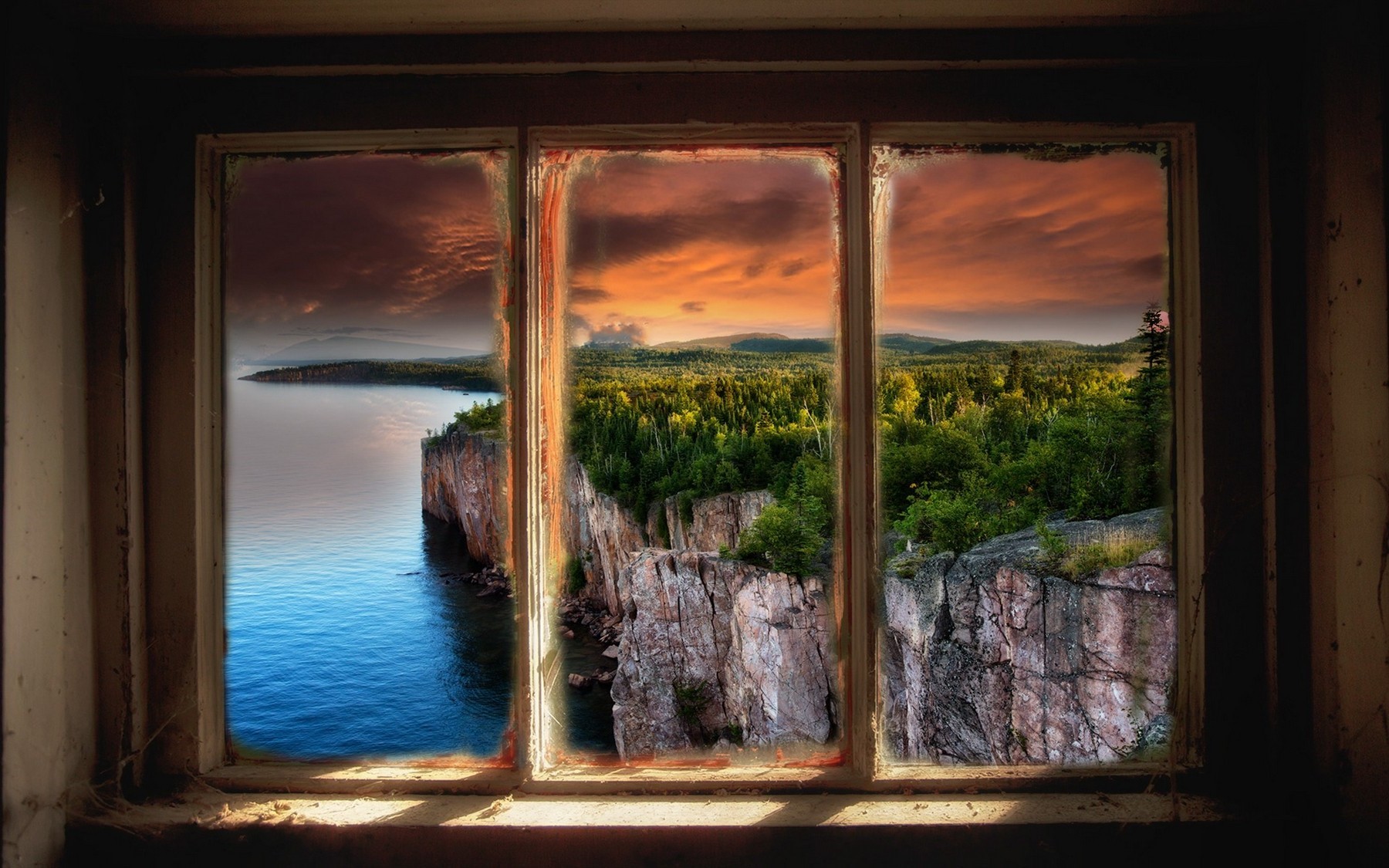 Cliffside forest and lake view through a window at sunset HD Wallpaper