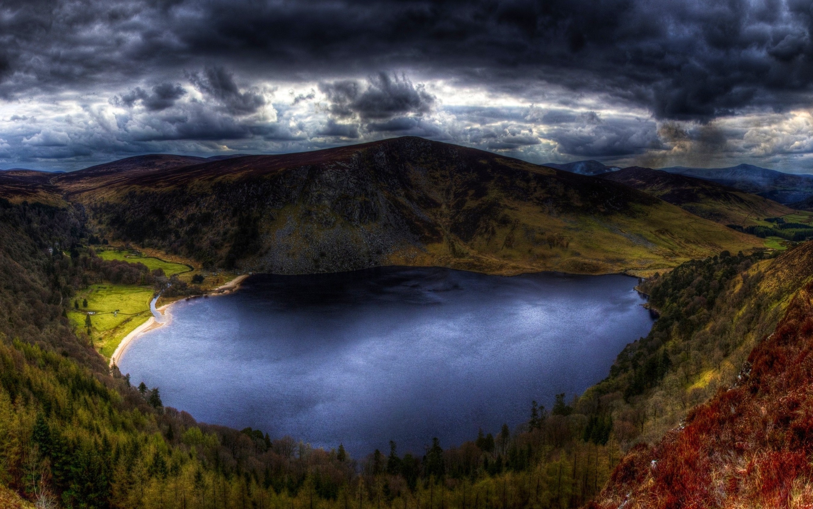 Dark Clouds Over a Lake and Mountains in Ireland HD Wallpaper