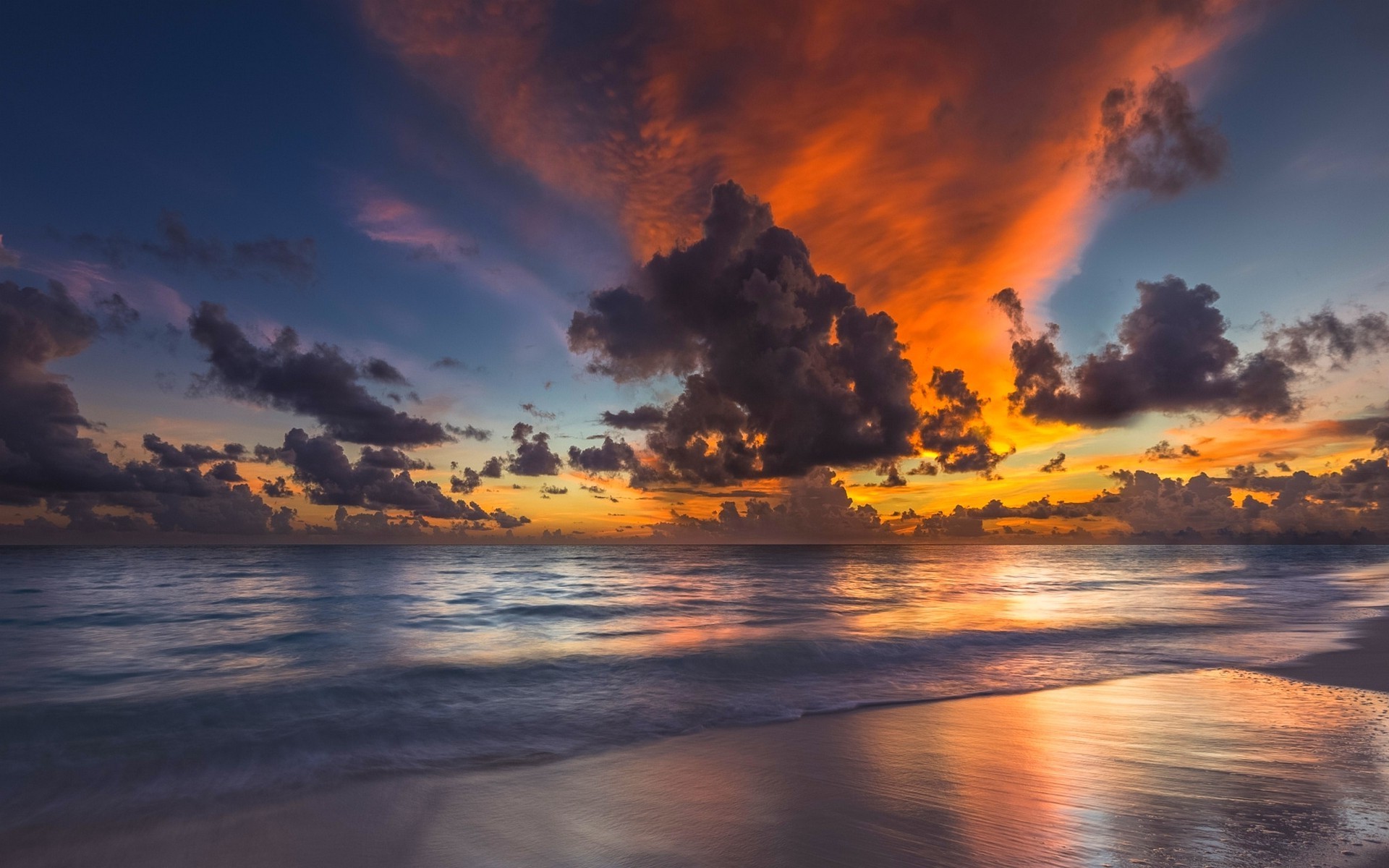Sunset over the ocean with dramatic clouds HD Wallpaper