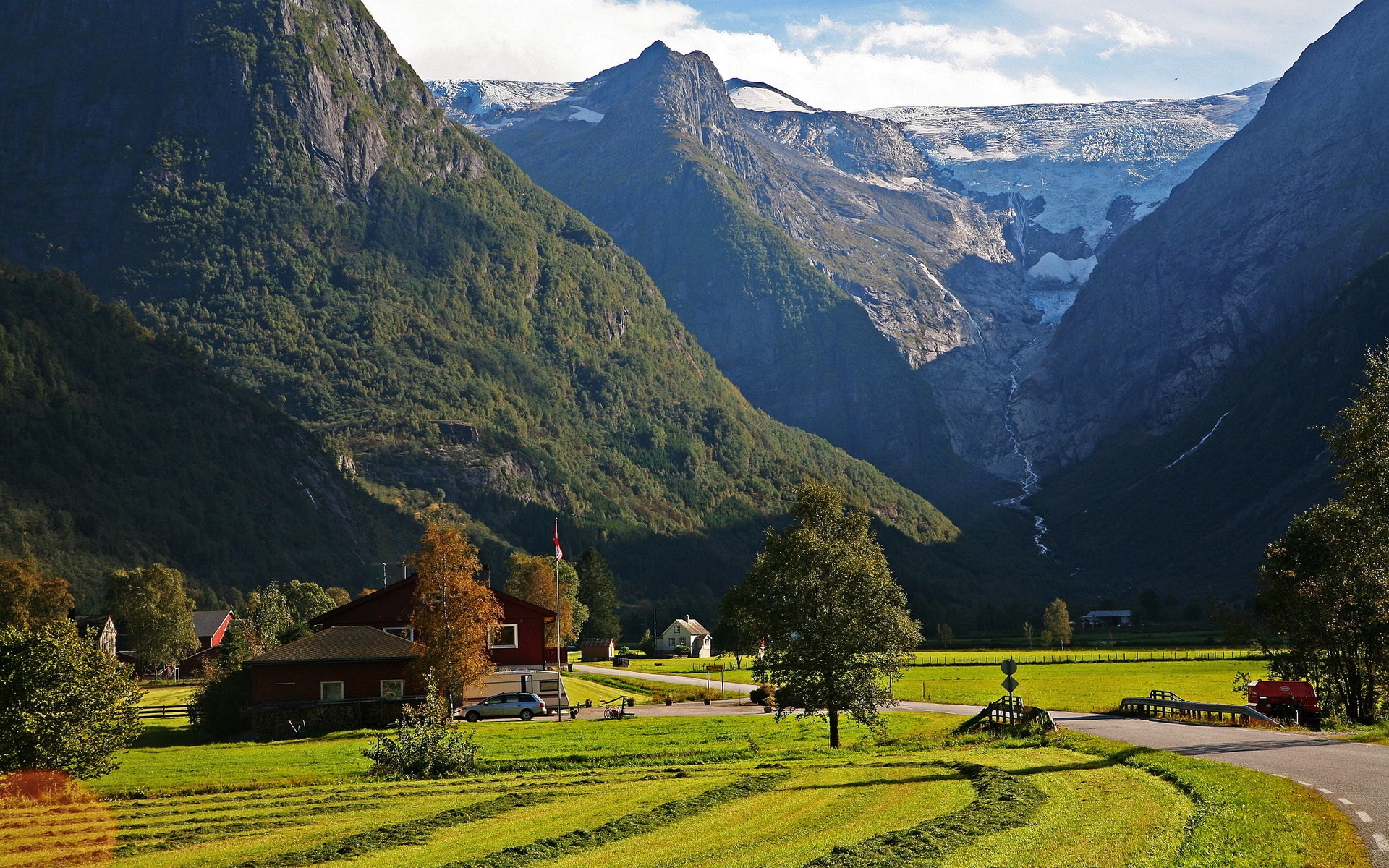 Mountain valley with glacier and village HD Wallpaper