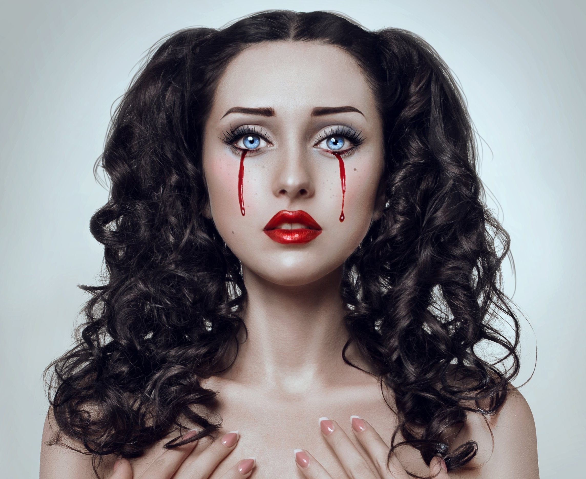 Woman with bloody tears and dark curly hair HD Wallpaper