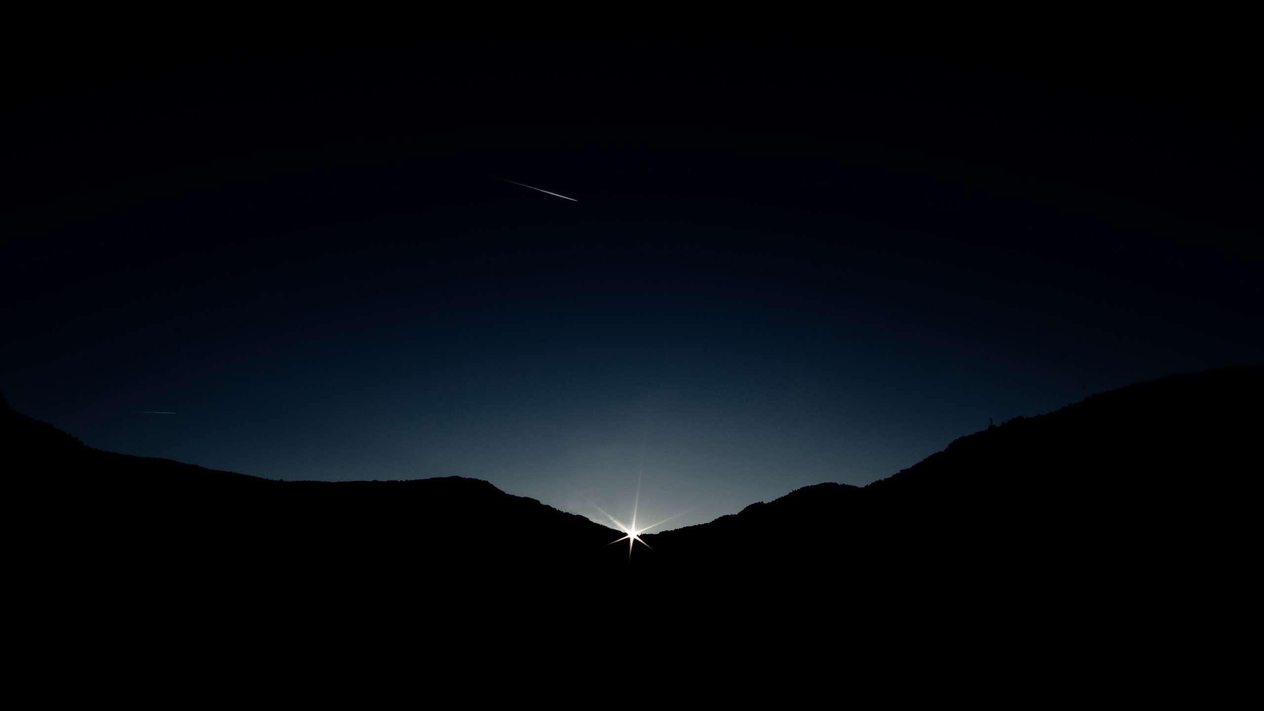 Sunrise over mountains with a shooting star HD Wallpaper