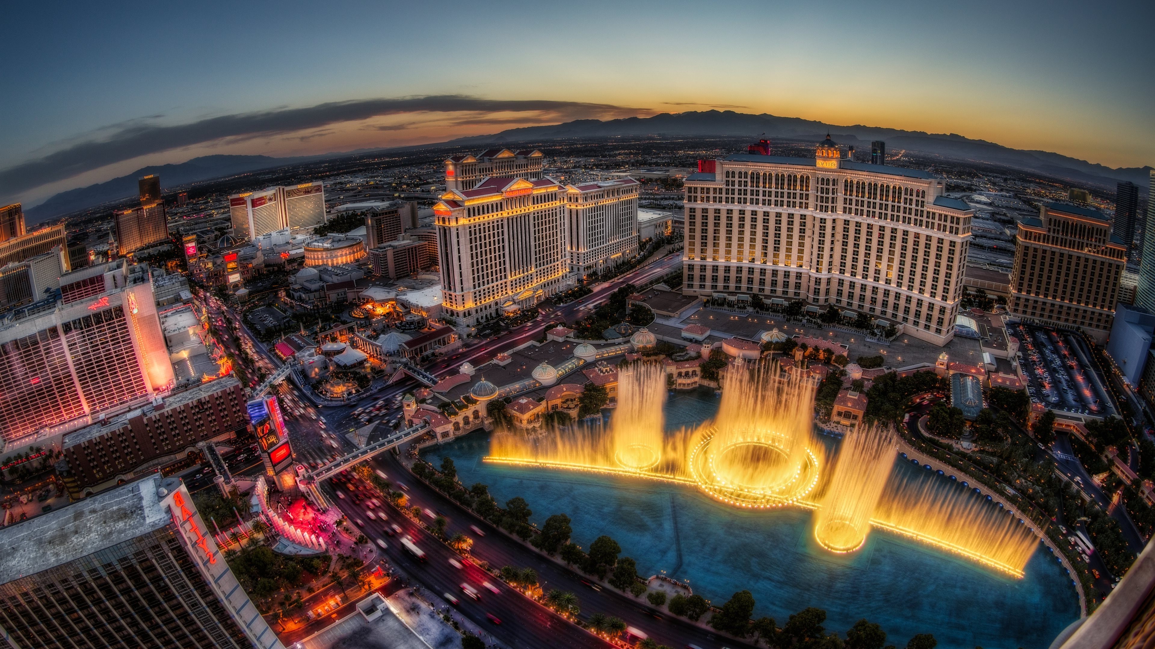 Las Vegas Strip at dusk with Bellagio fountains HD Wallpaper