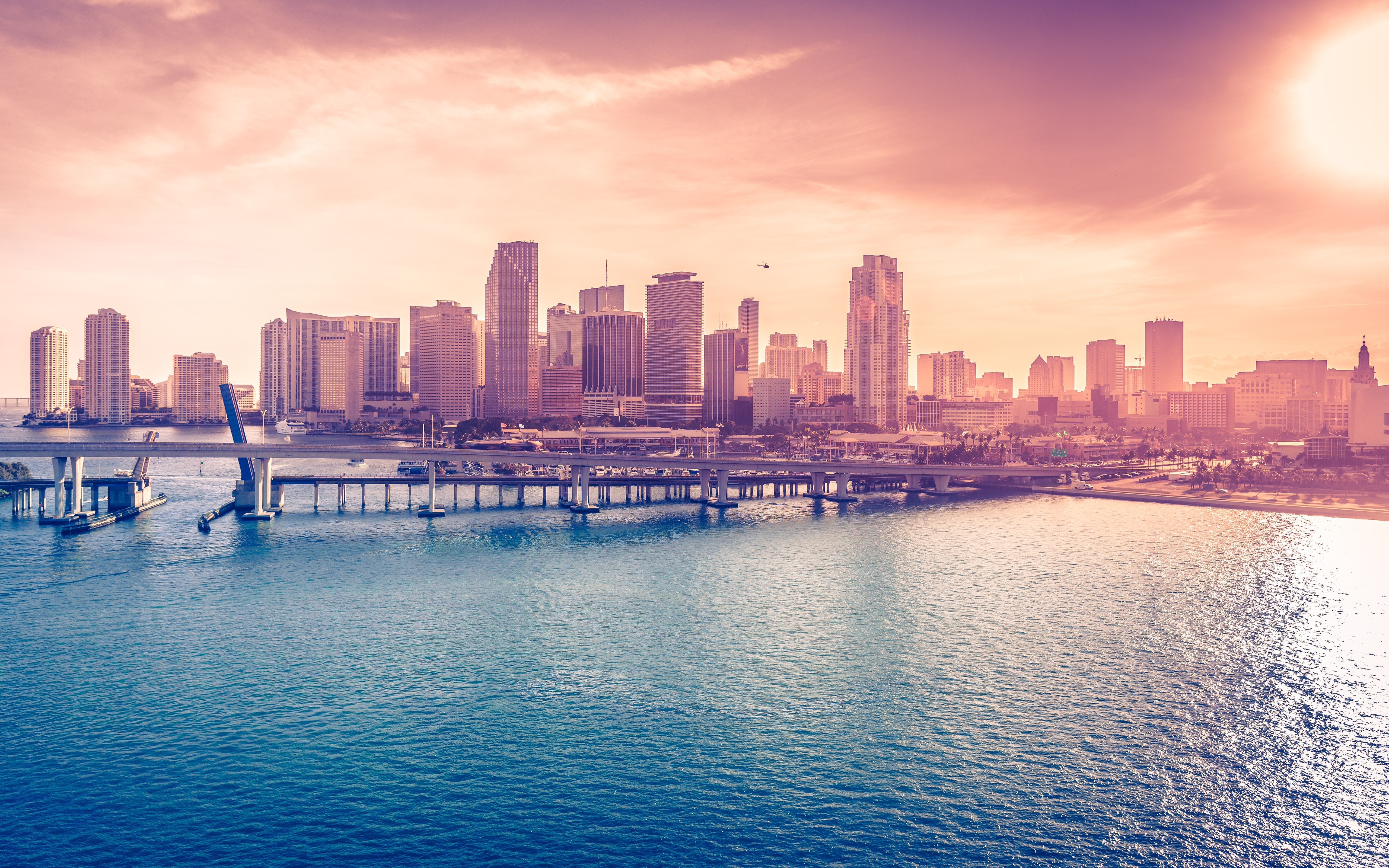 Miami skyline with bridge over water at sunset HD Wallpaper