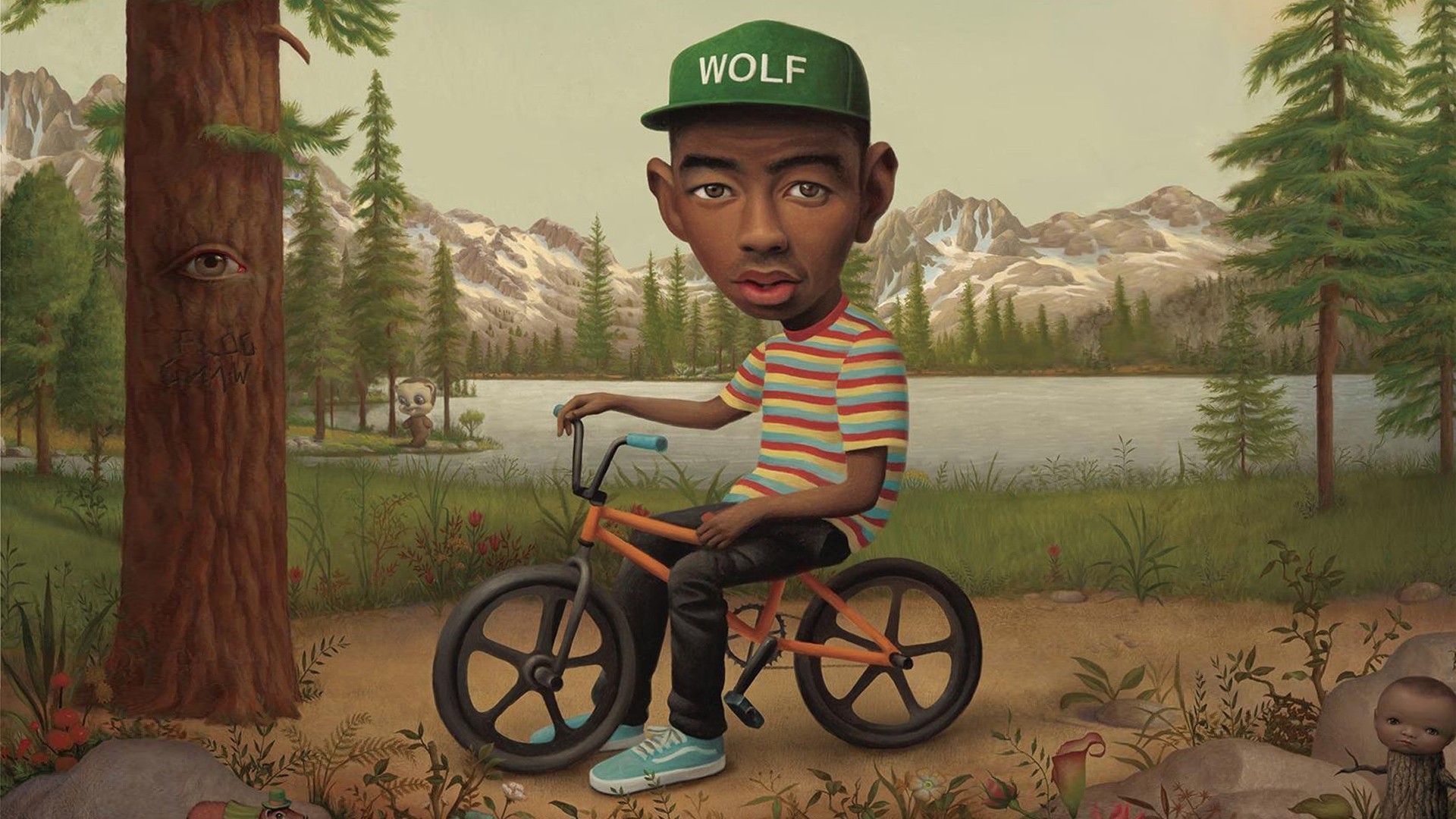 Tyler the Creator on a BMX bike in a forest landscape HD Wallpaper