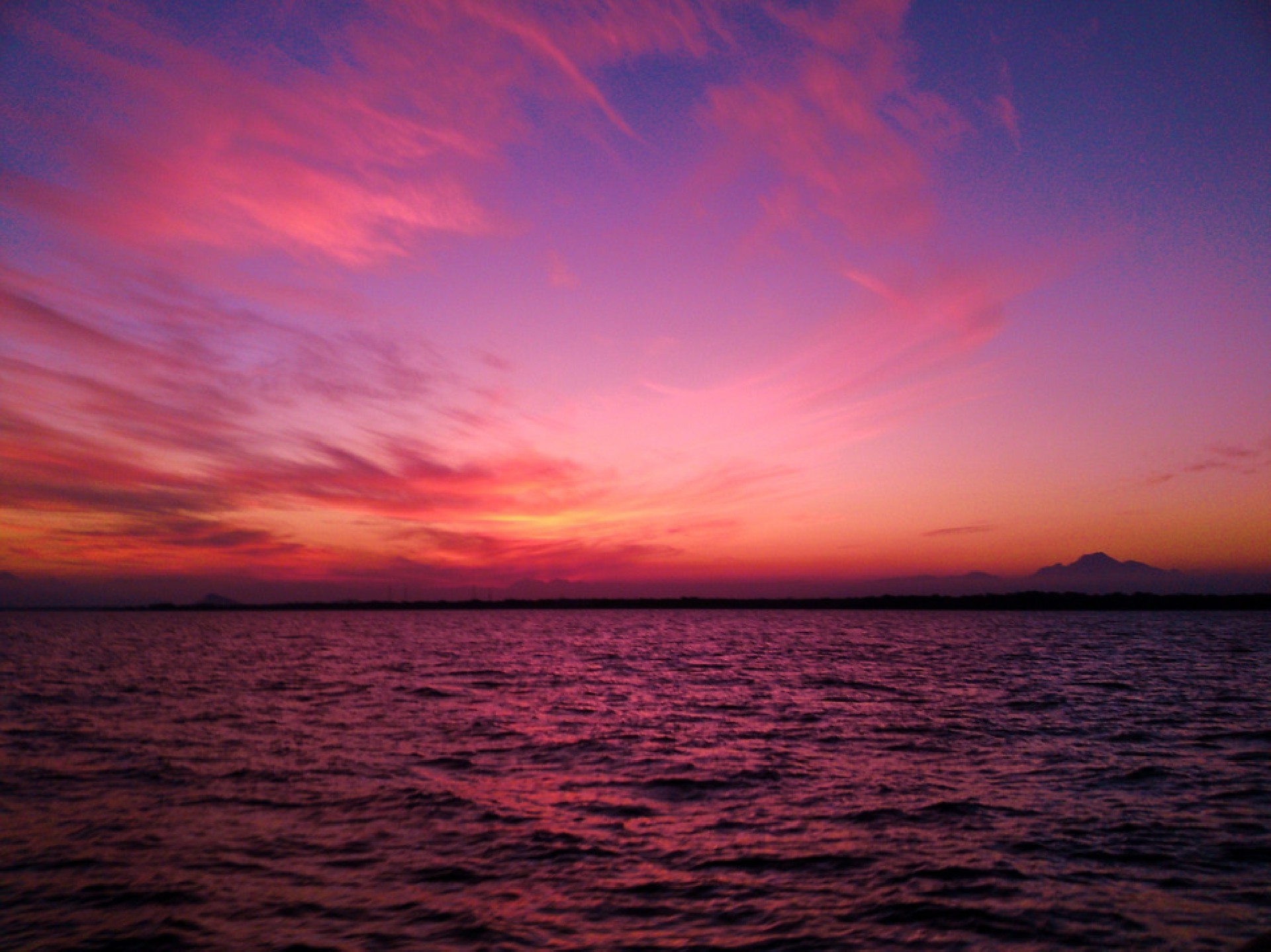 Sunset over the ocean with colorful clouds HD Wallpaper