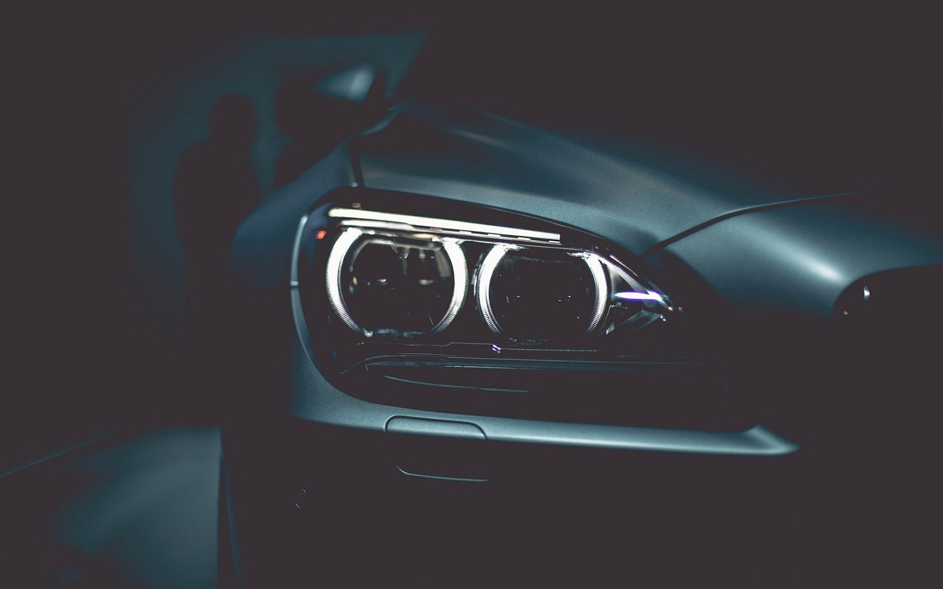 BMW headlights closeup dark HD Wallpaper