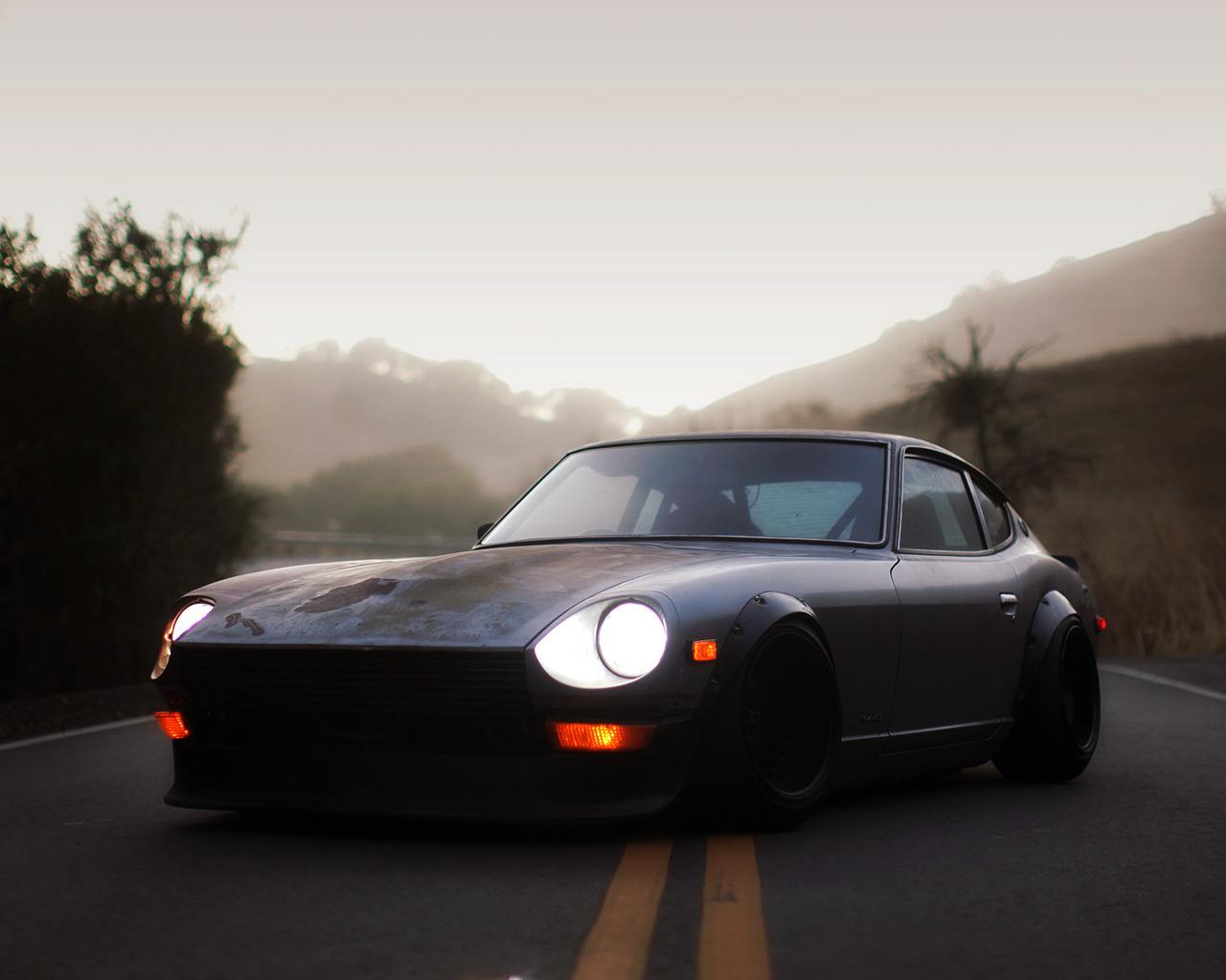 Modified Datsun 240Z on a foggy road HD Wallpaper