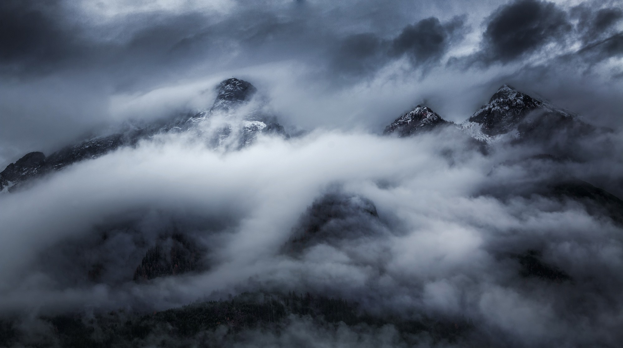 Dark, misty mountains shrouded in clouds HD Wallpaper